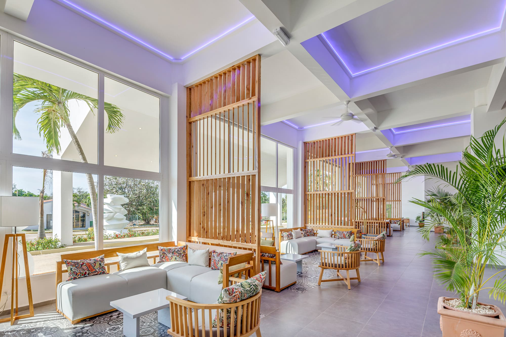 a room with a large window and a couch