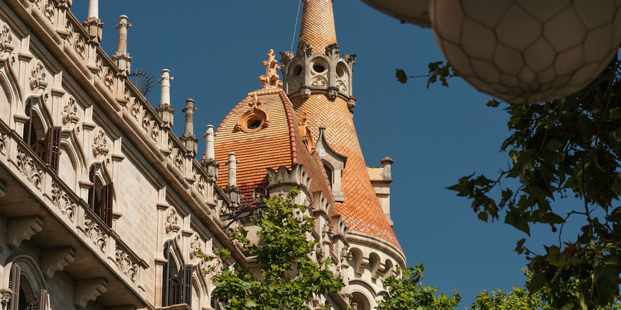 a building with a dome roof and trees