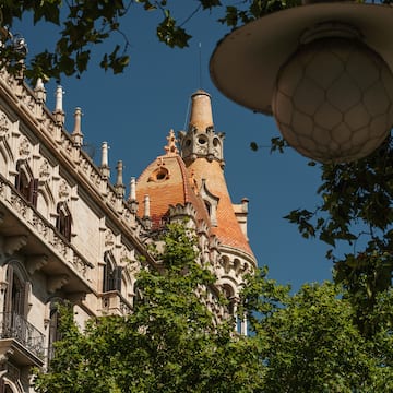 a building with a dome roof and trees