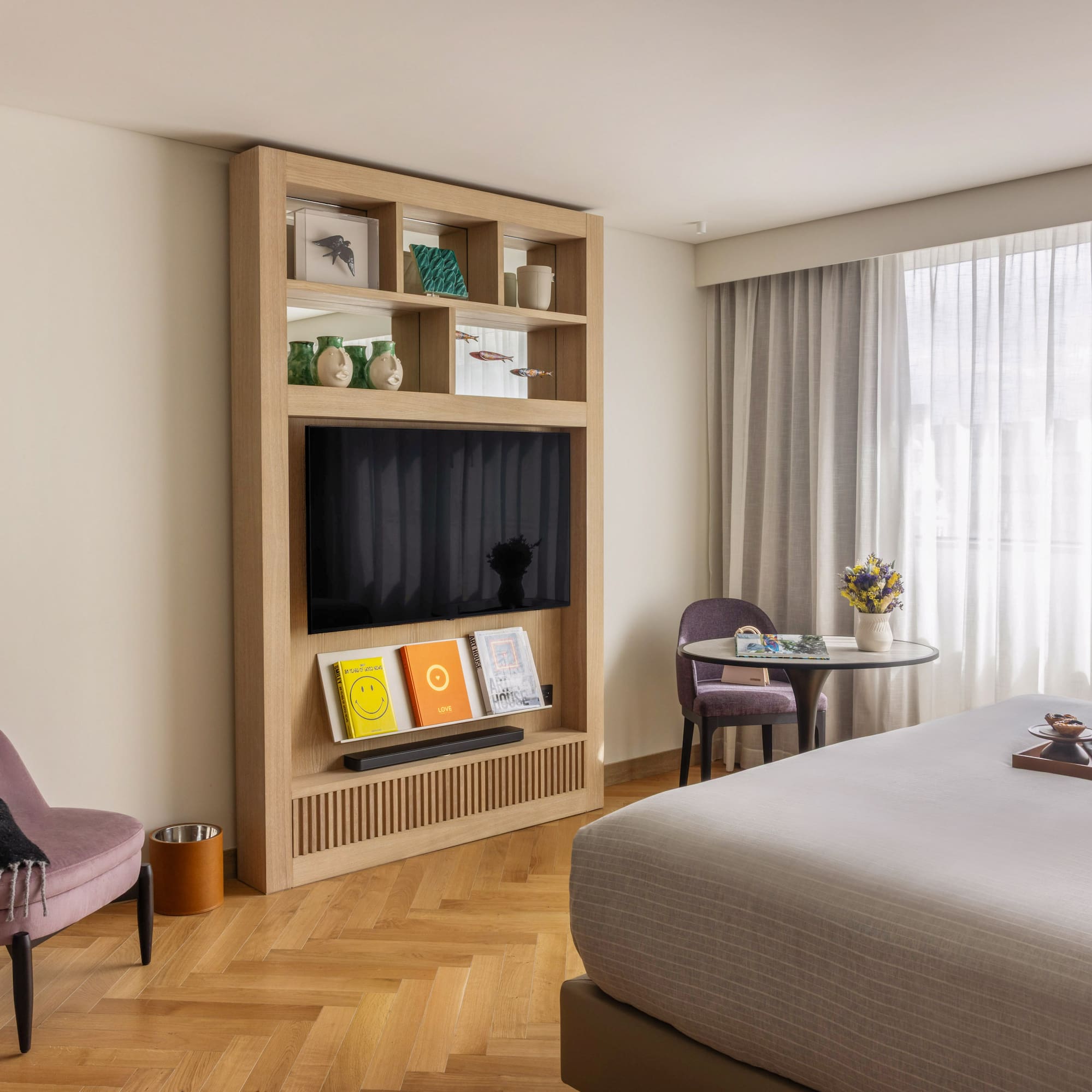 a room with a bed and a tv