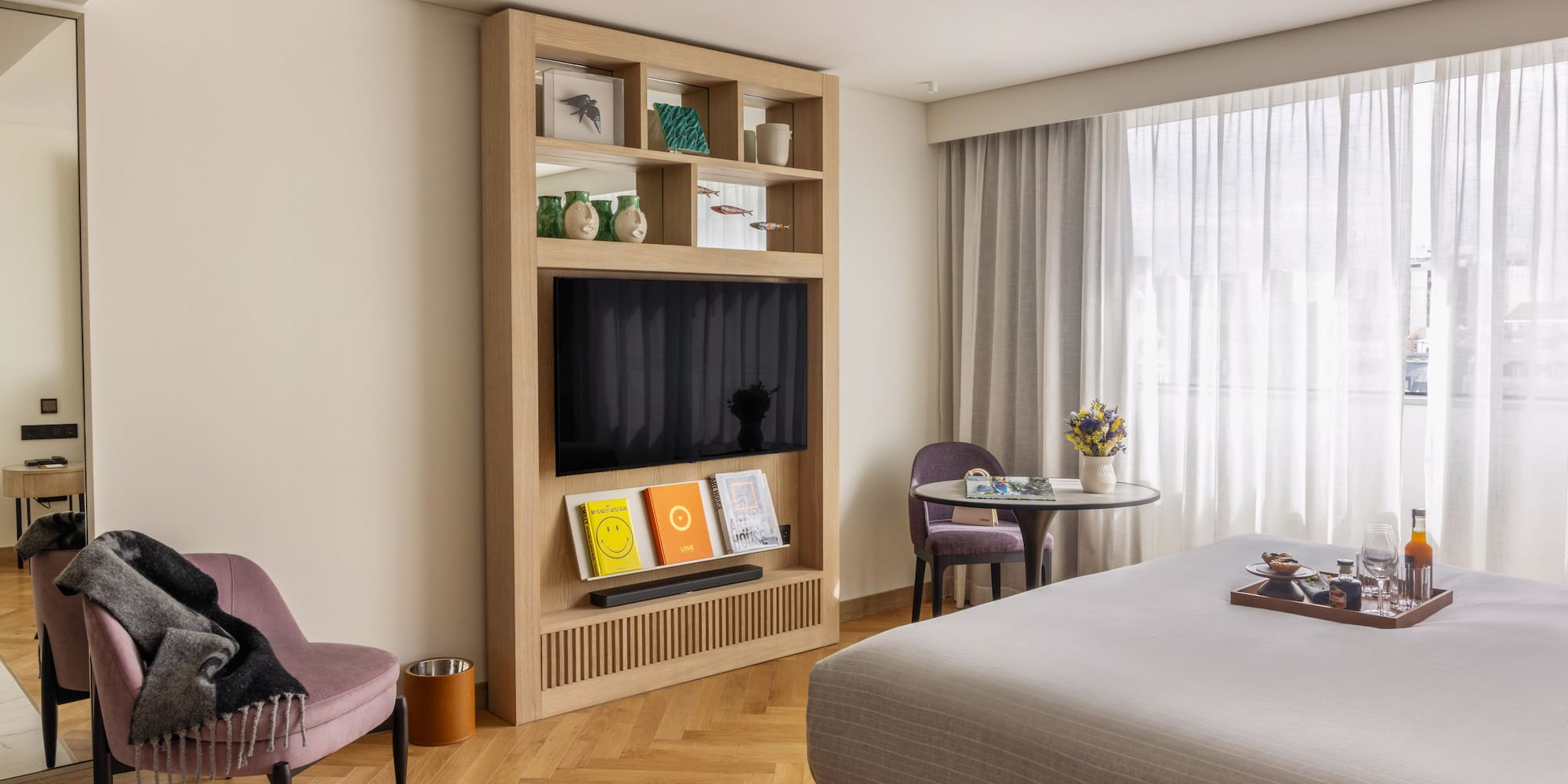 a room with a bed and a tv