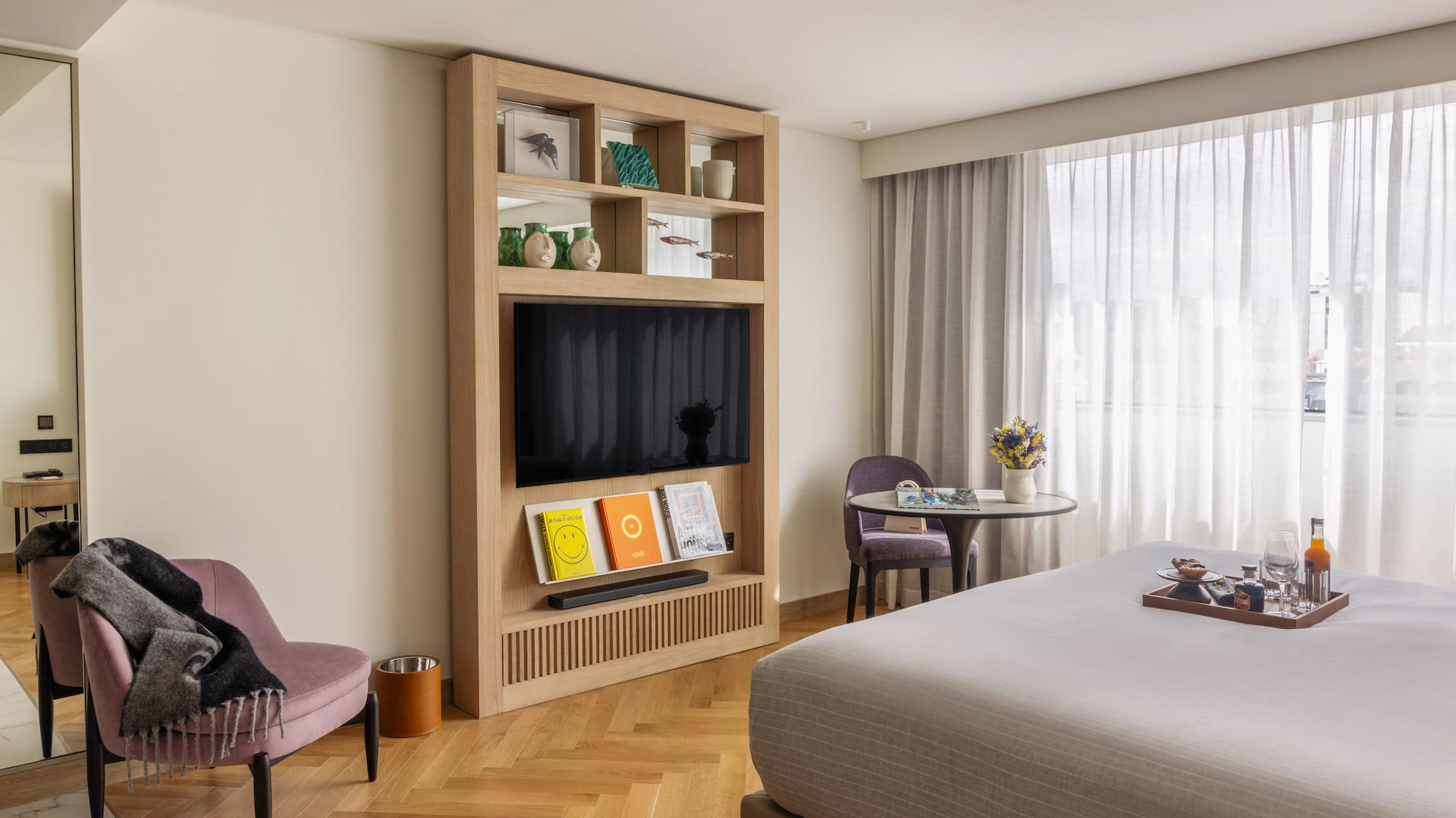 a room with a bed and a tv