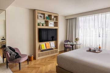 a room with a bed and a tv