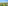Aerial tropical resort with beach, ocean, palm trees, canals, and event setup.