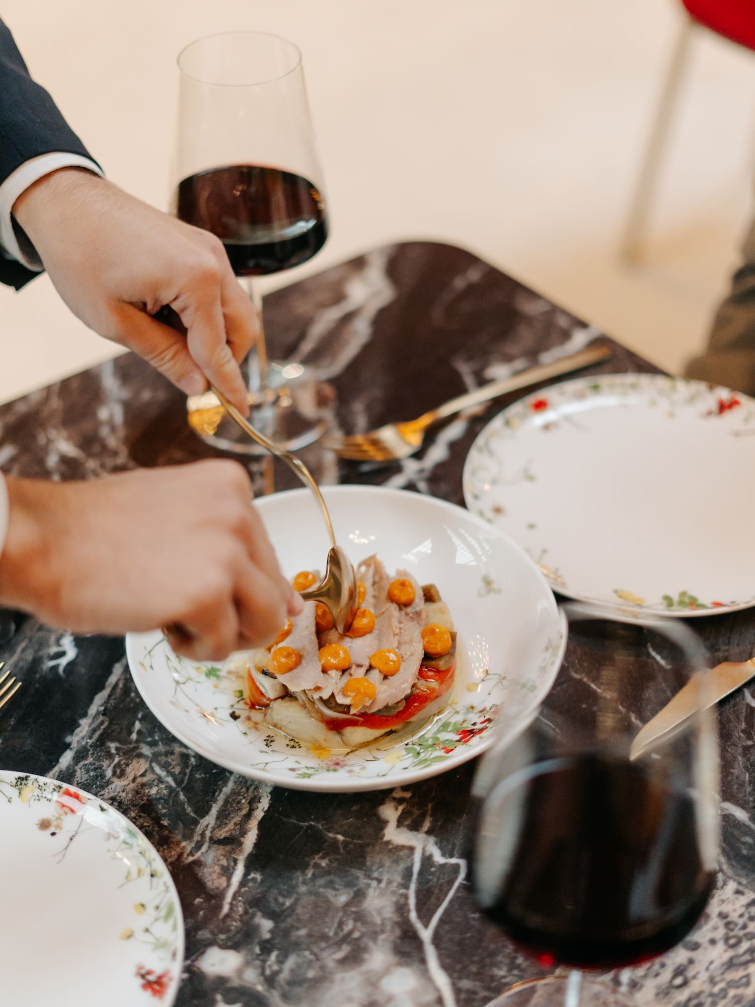 a person eating food on a plate