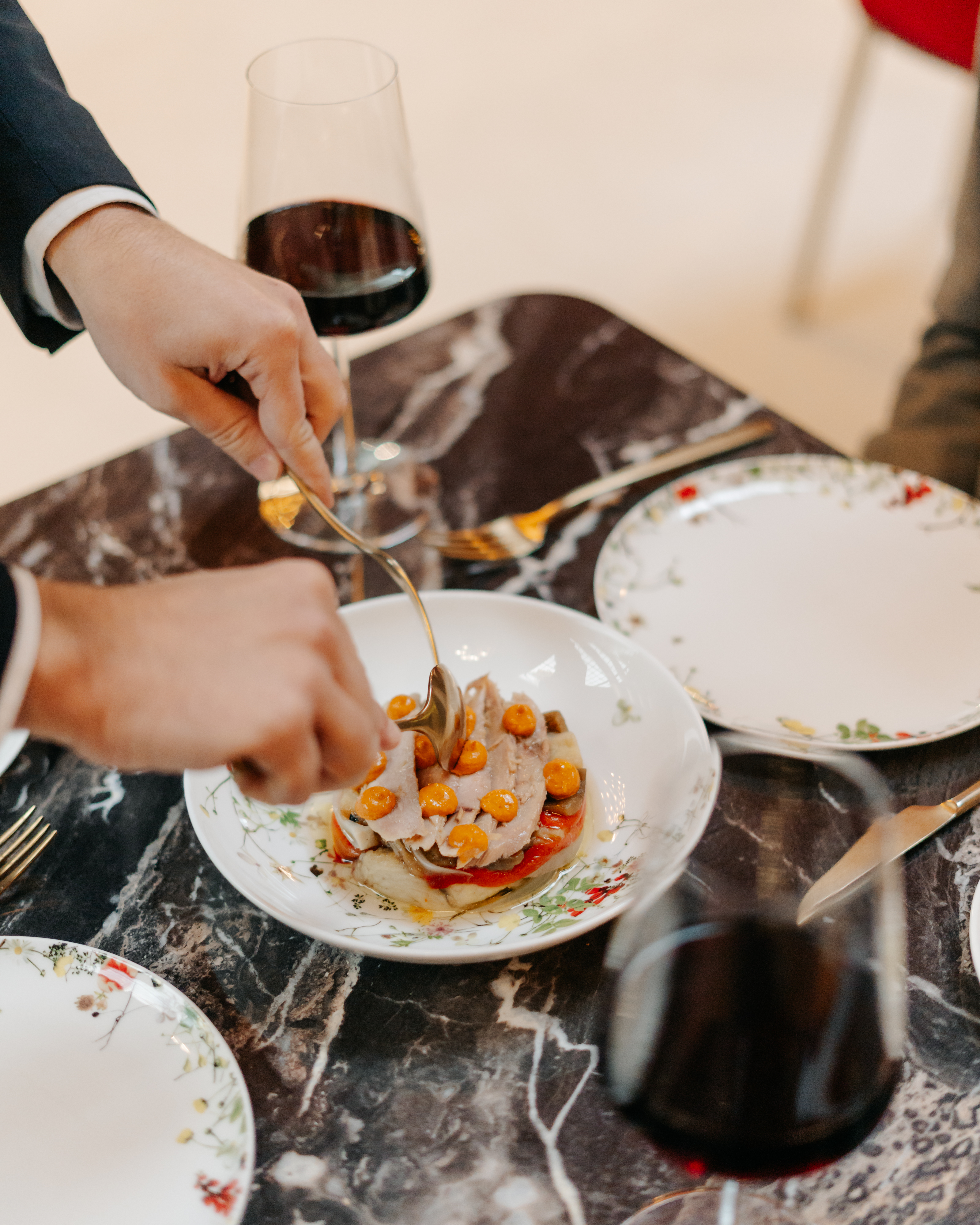 a person eating food on a plate