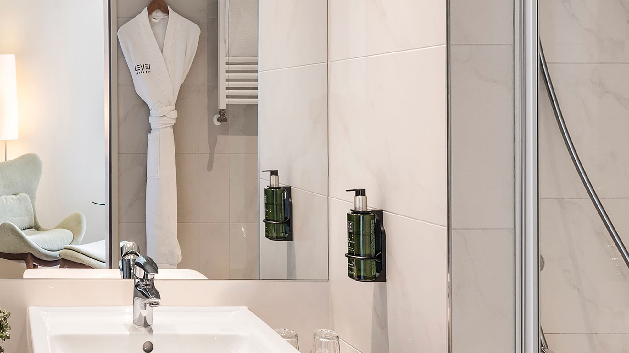 a bathroom with a sink and shower