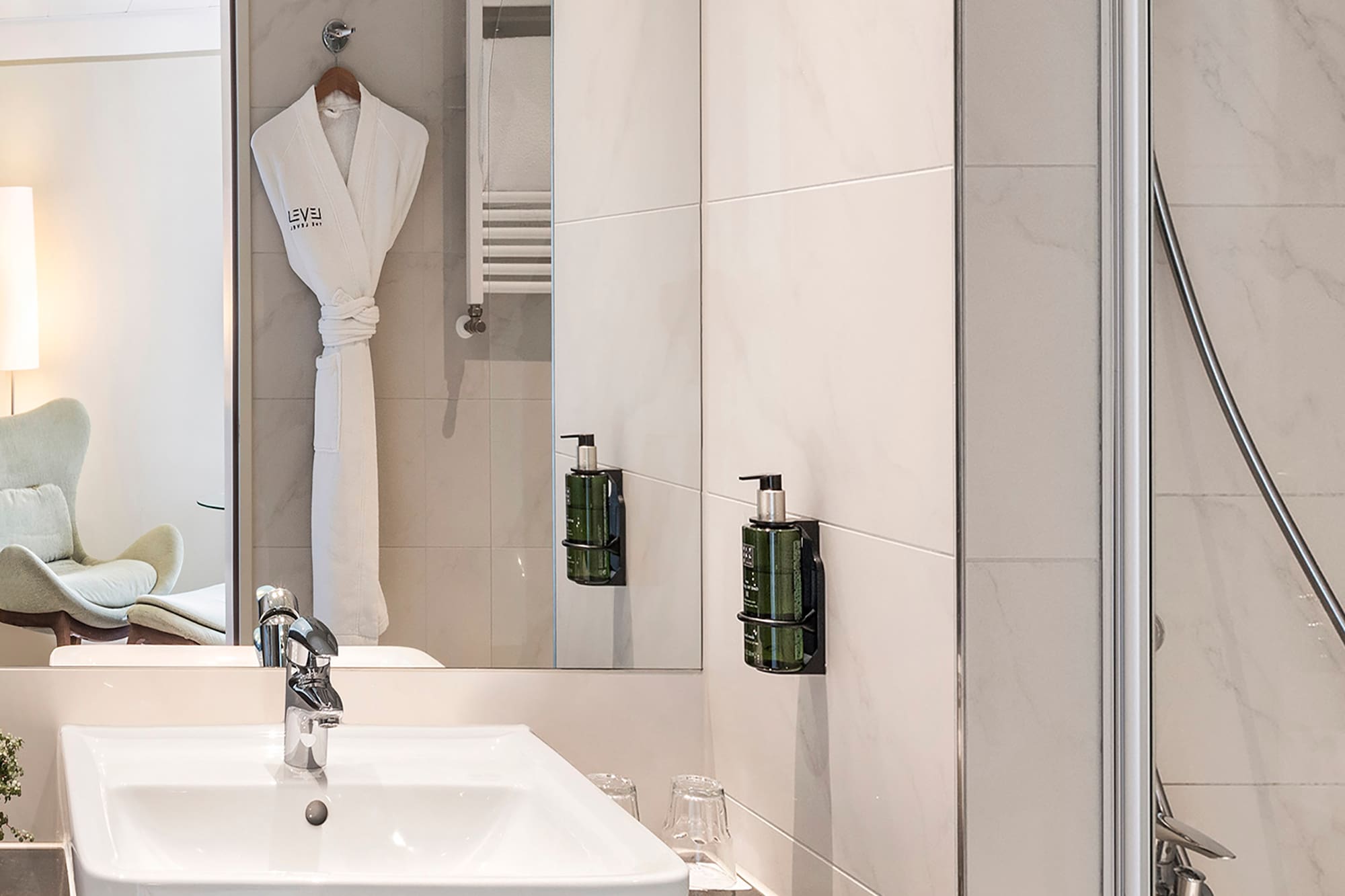 a bathroom with a sink and shower