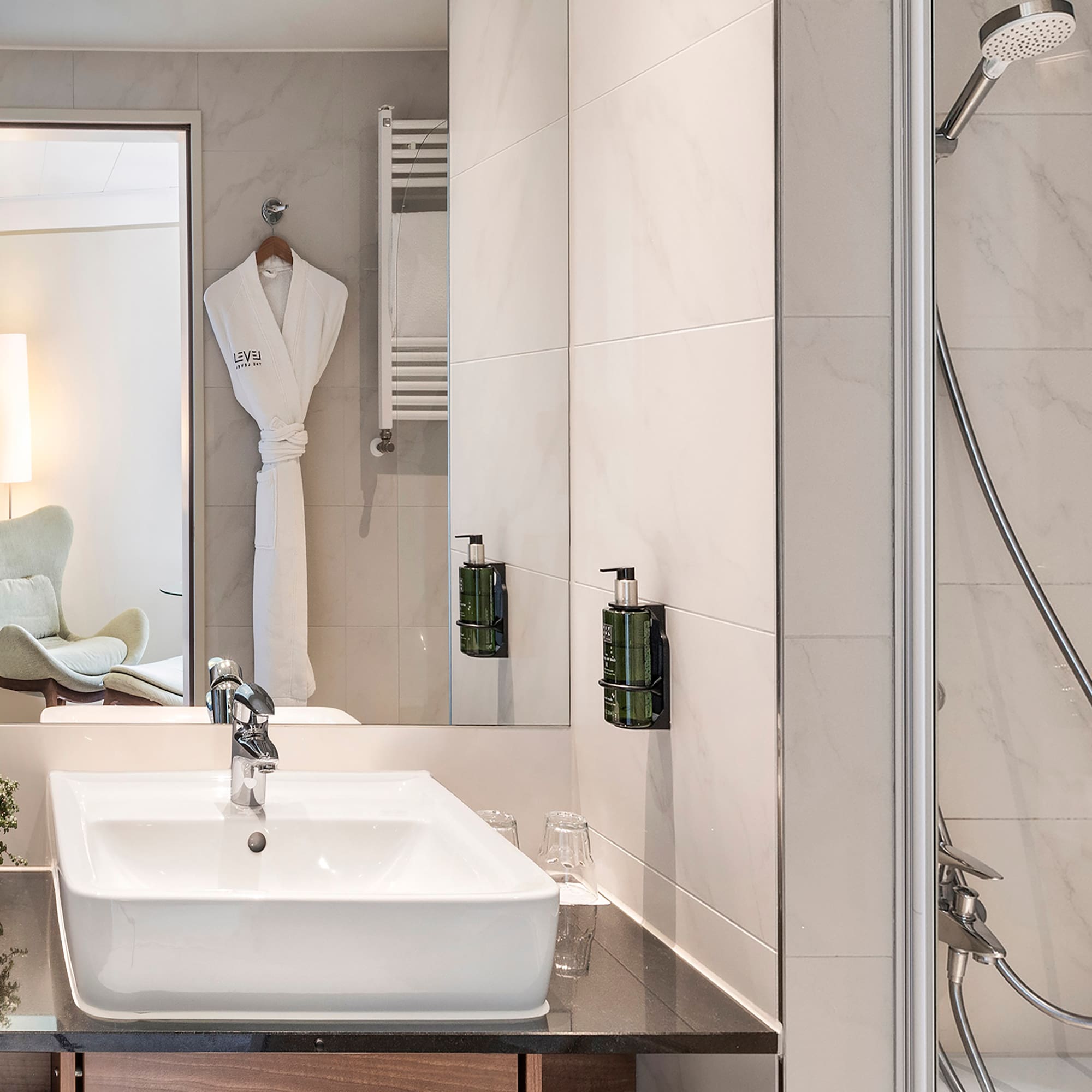 a bathroom with a sink and shower