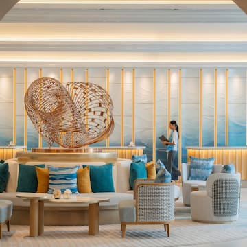 a woman standing in a lobby