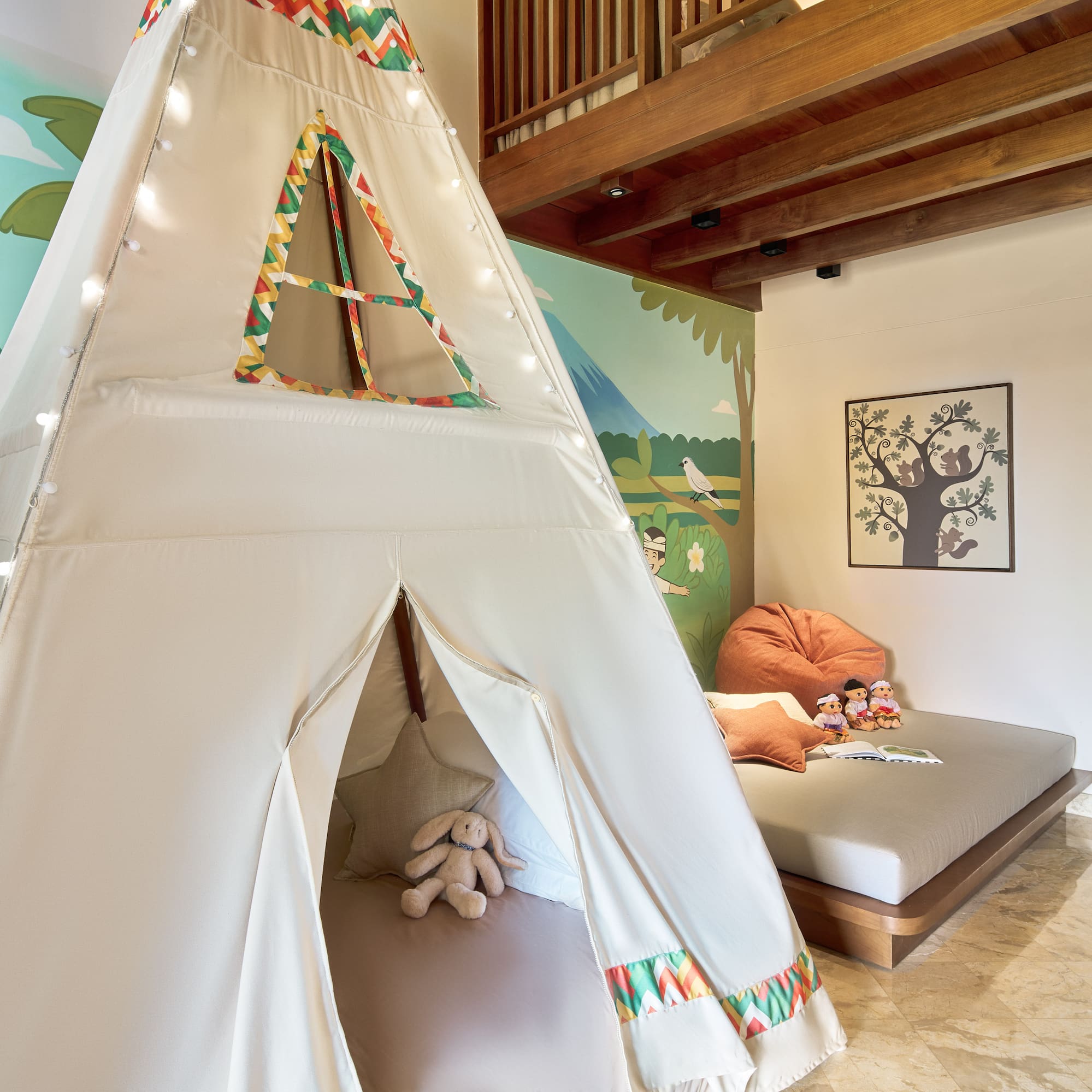 a teepee tent in a room with a bed and a bed