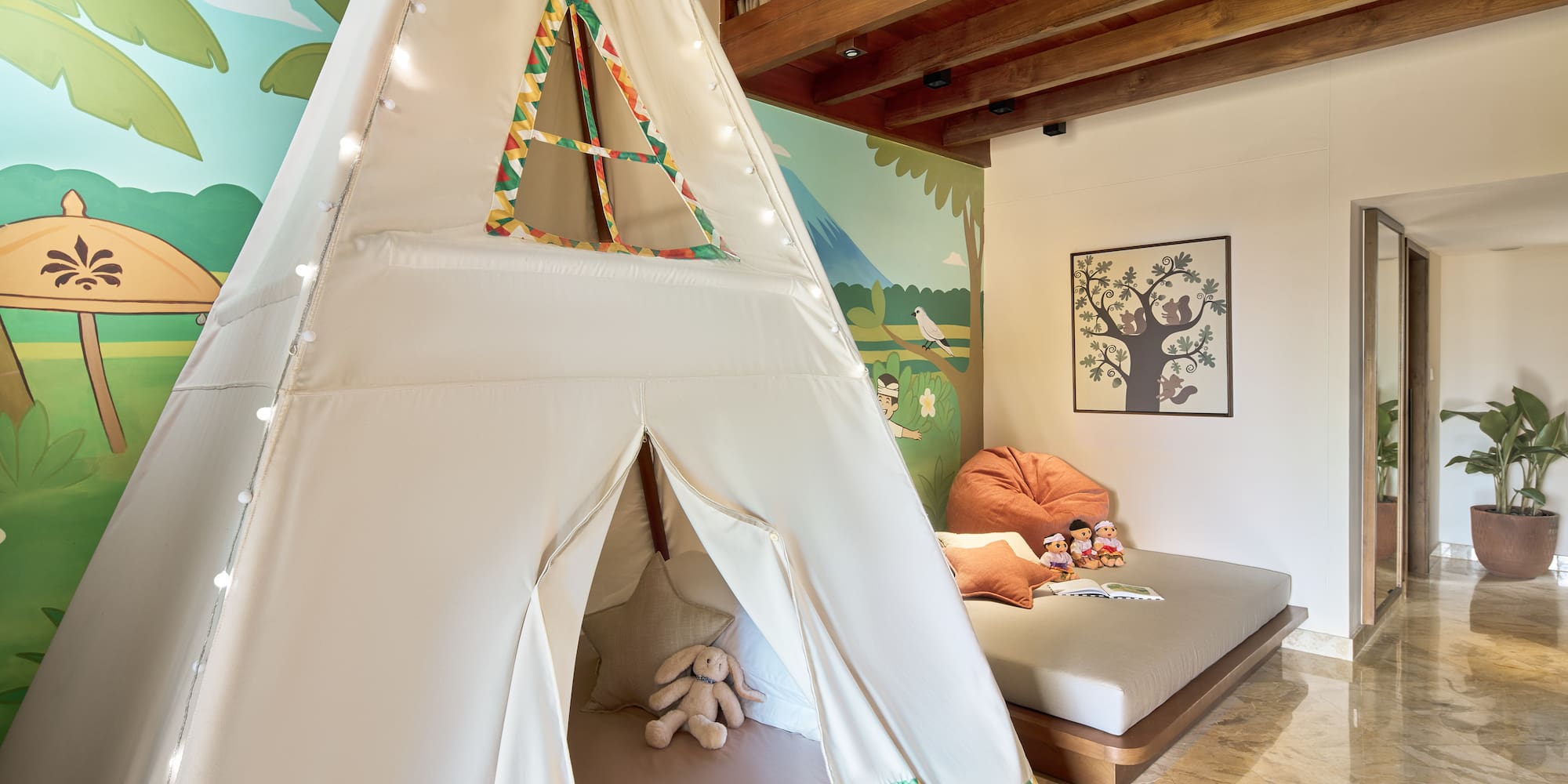 a teepee tent in a room with a bed and a bed