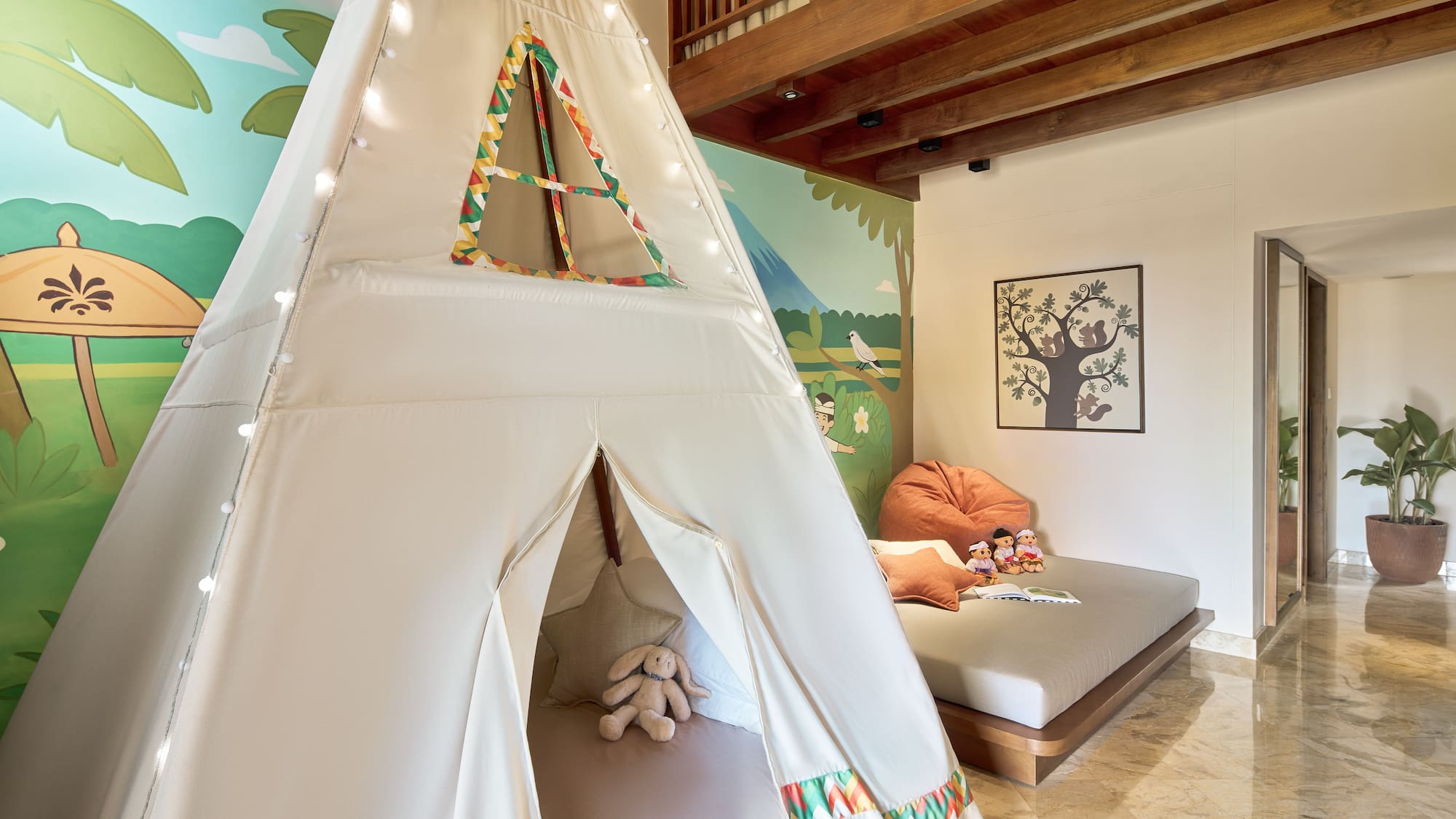 a teepee tent in a room with a bed and a bed