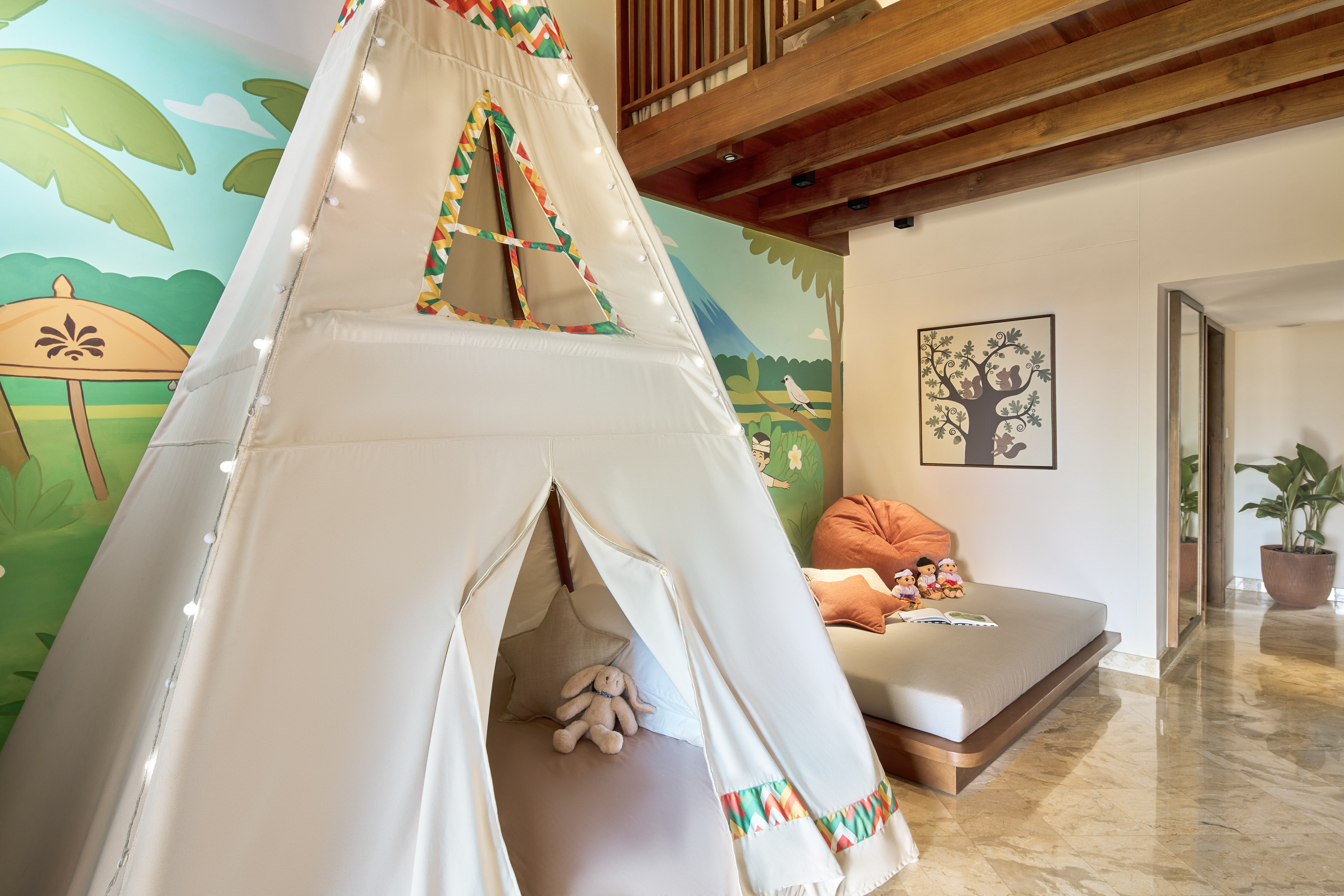 a teepee tent in a room with a bed and a bed