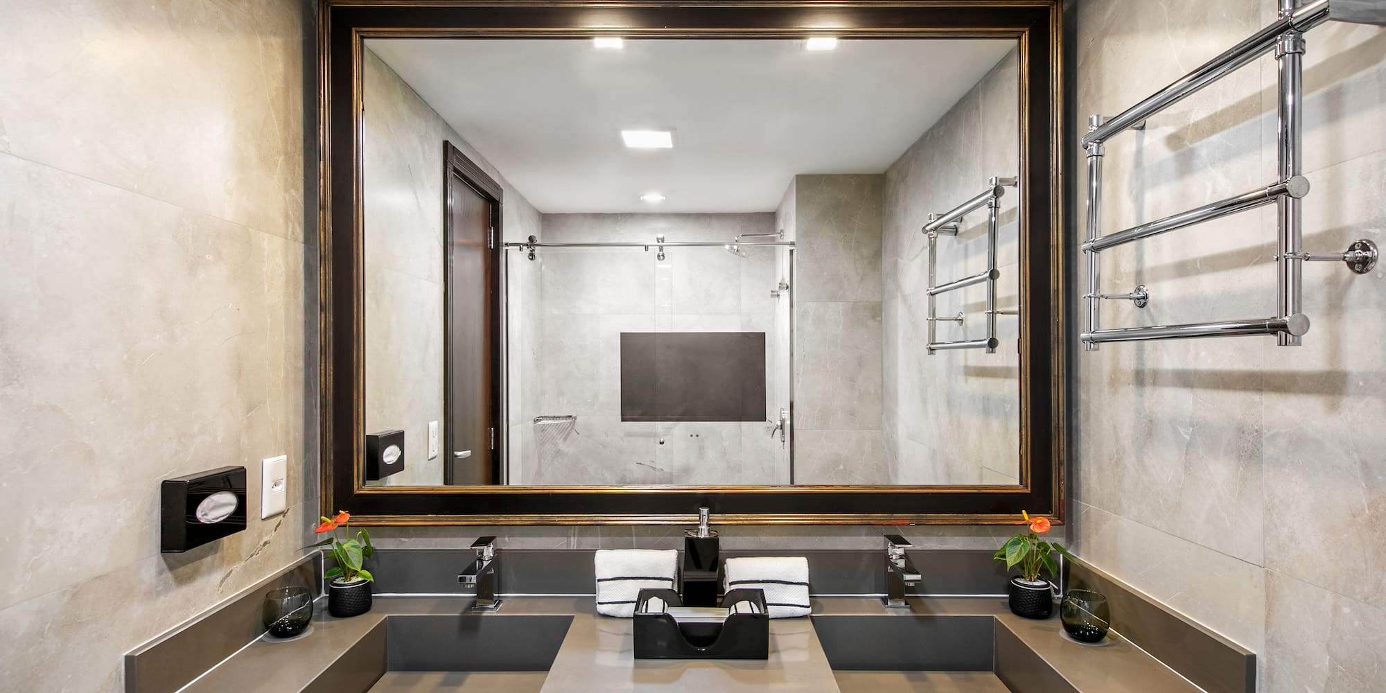 a bathroom with a mirror and sinks