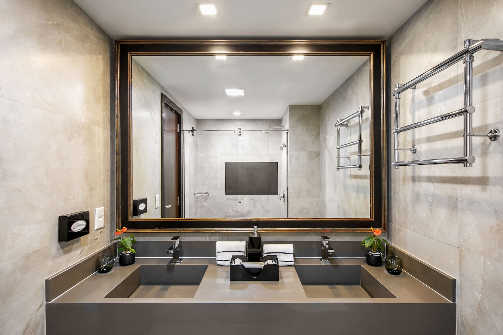 a bathroom with a mirror and sinks