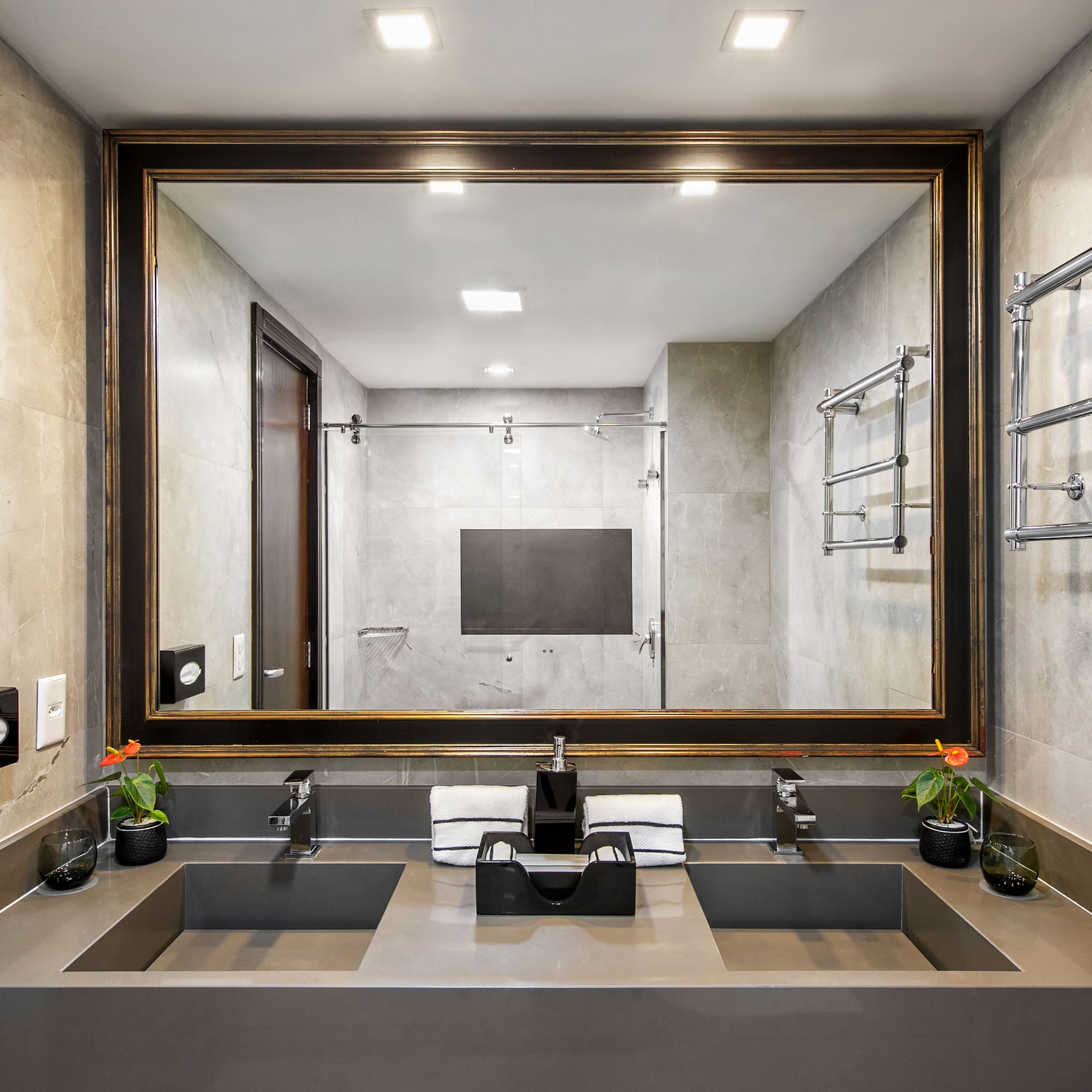 a bathroom with a mirror and sinks