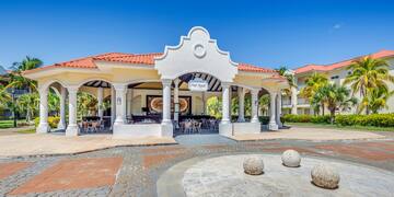 a building with columns and a round stone circle