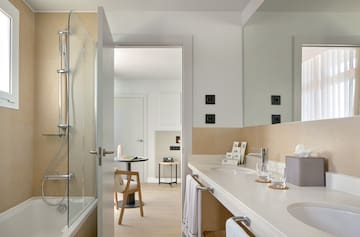 a bathroom with a shower and sink