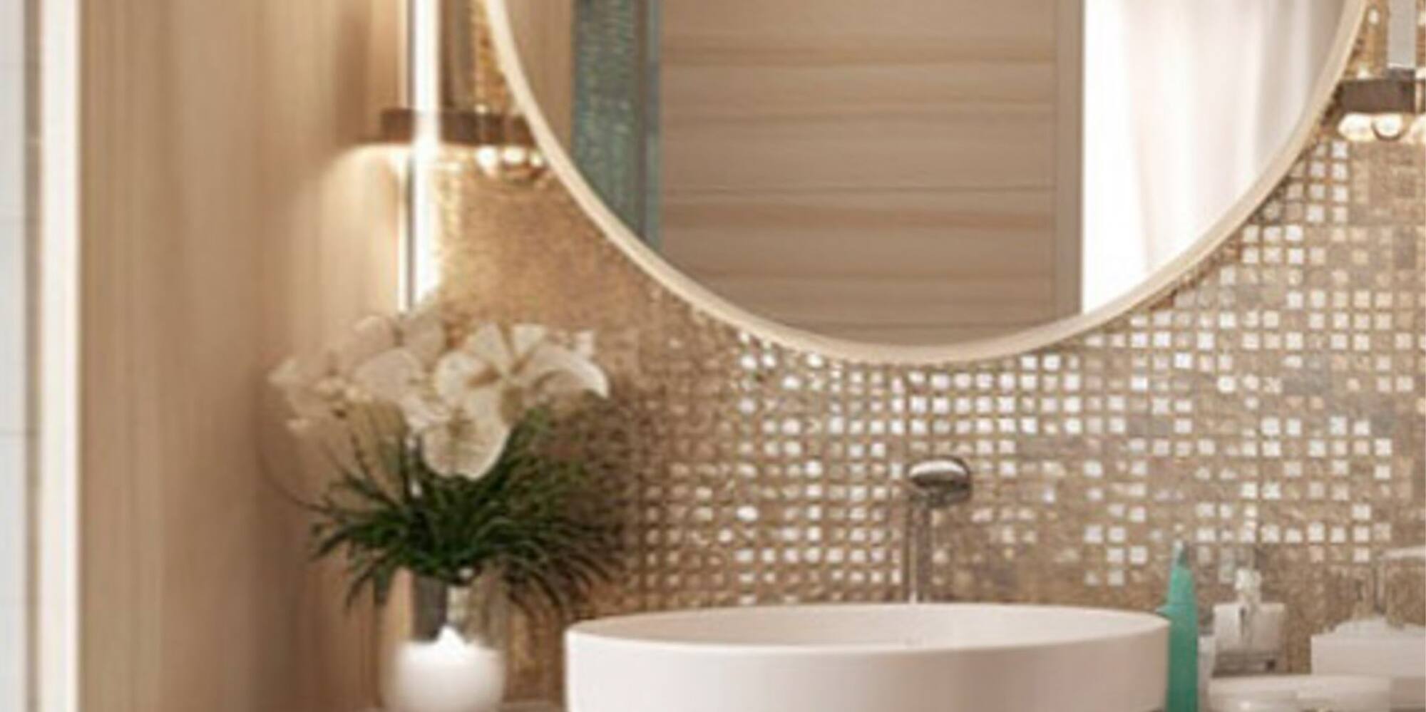 a bathroom with a round mirror