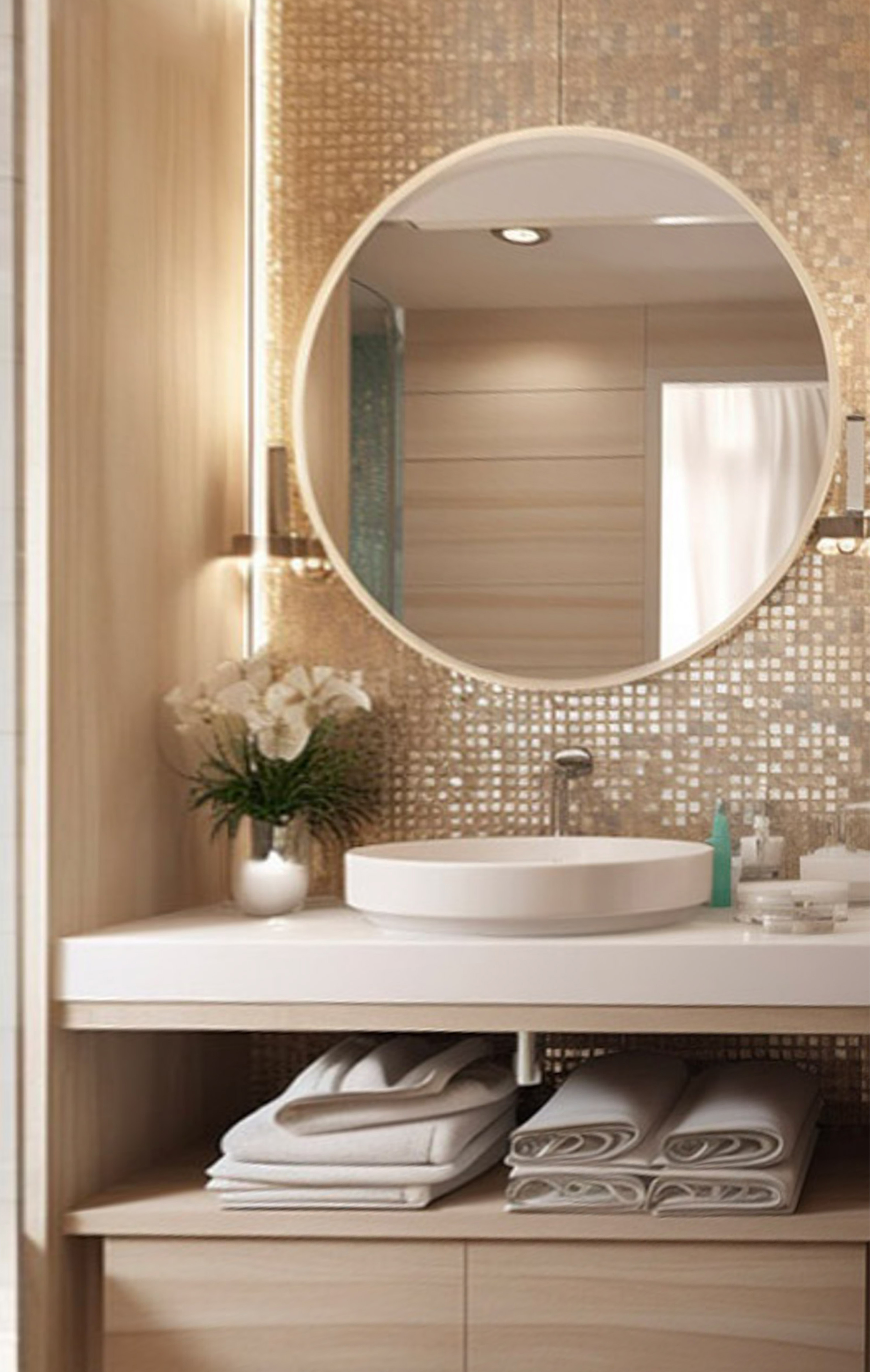 a bathroom with a round mirror