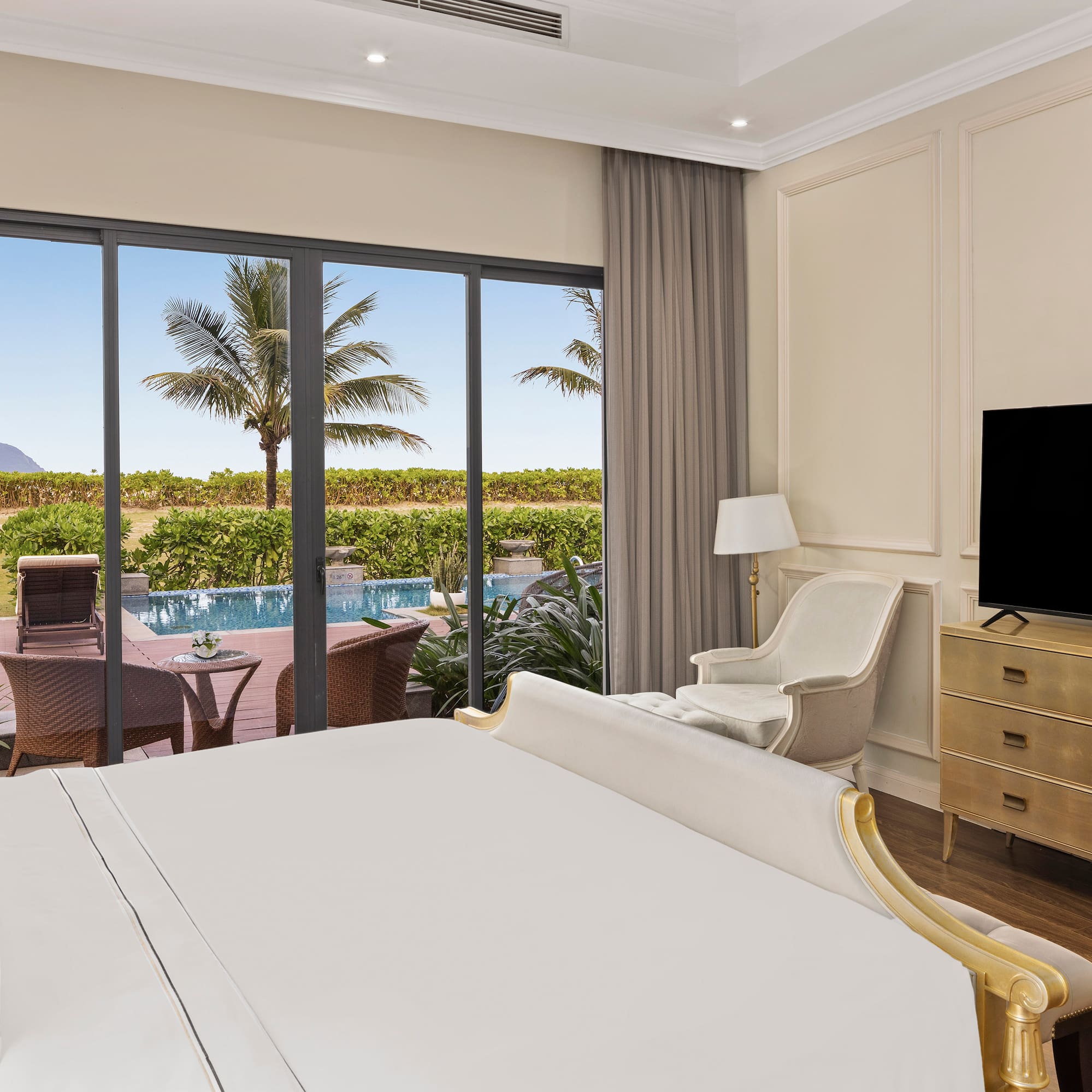 a room with a bed and a television