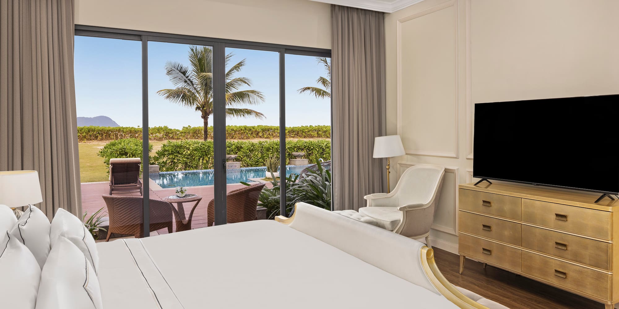 a room with a bed and a television