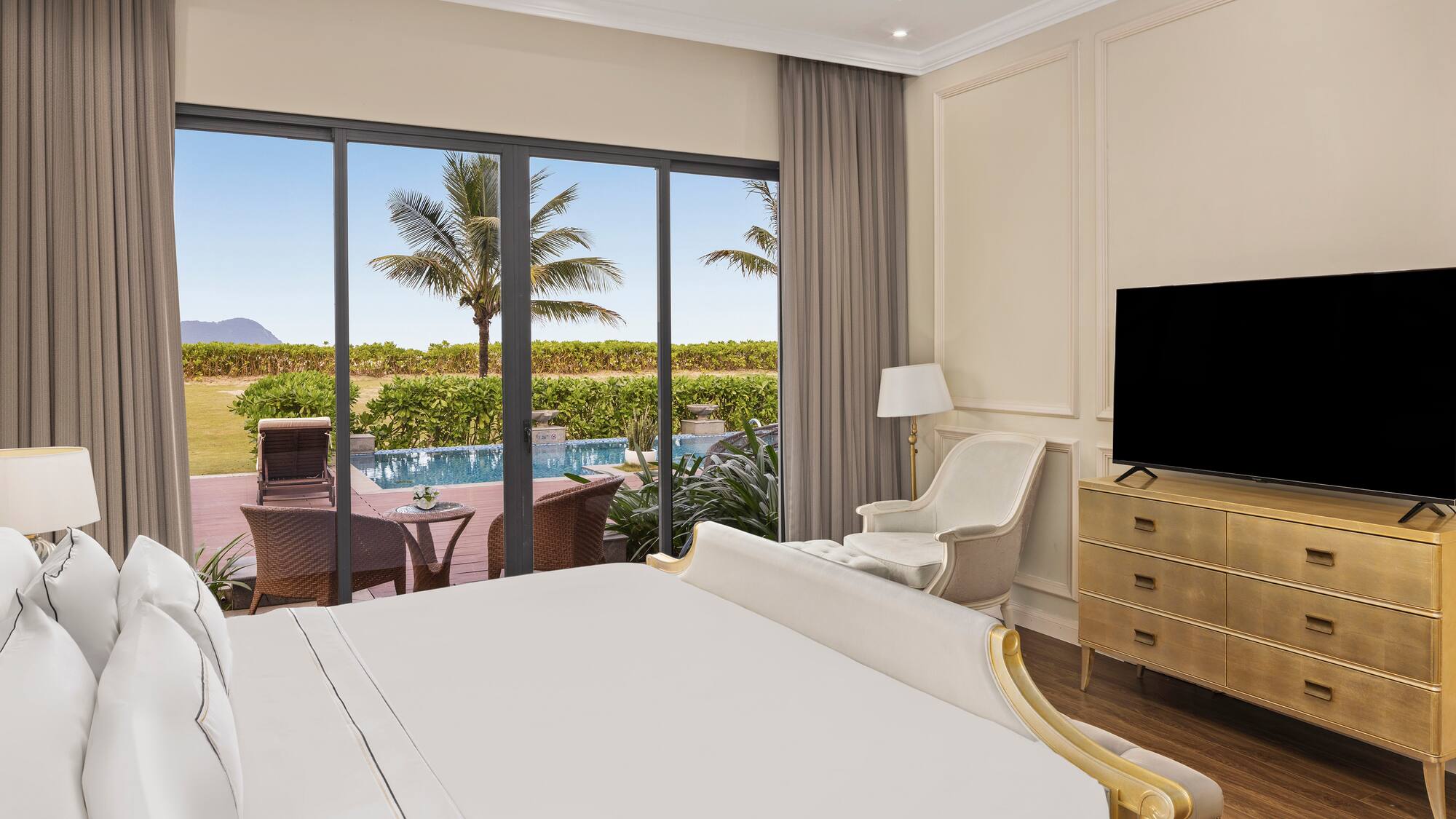 a room with a bed and a television