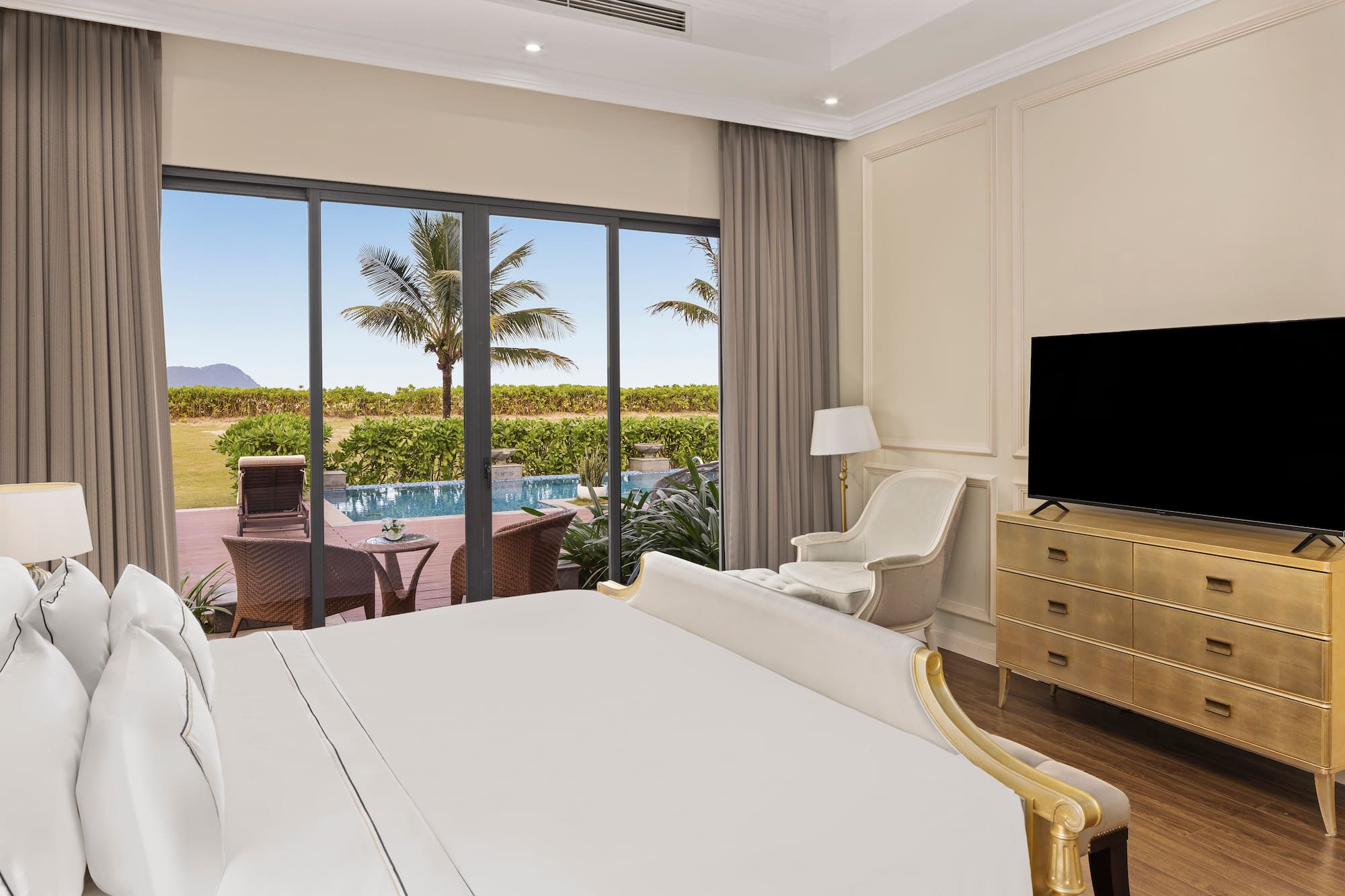 a room with a bed and a television