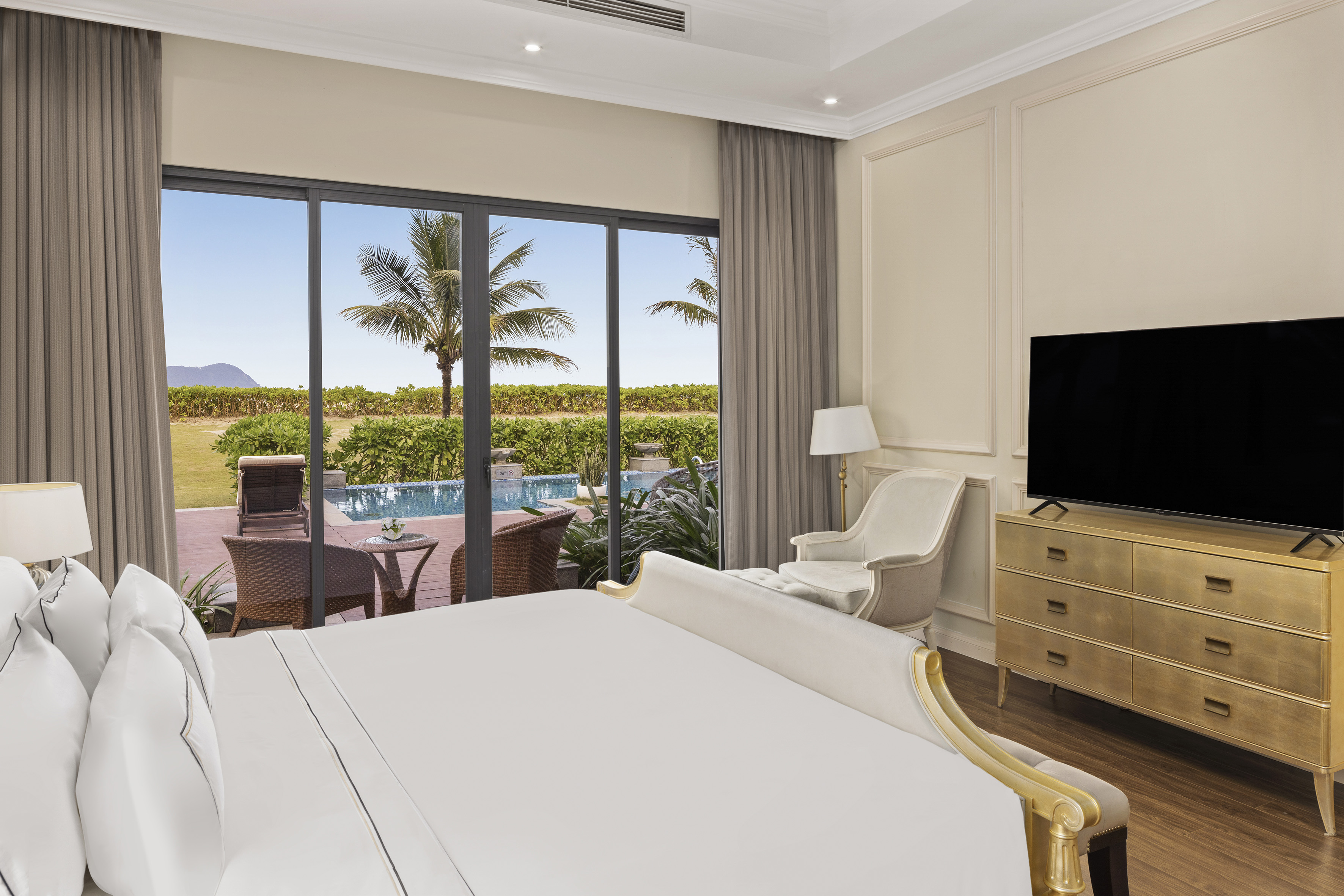 a room with a bed and a television