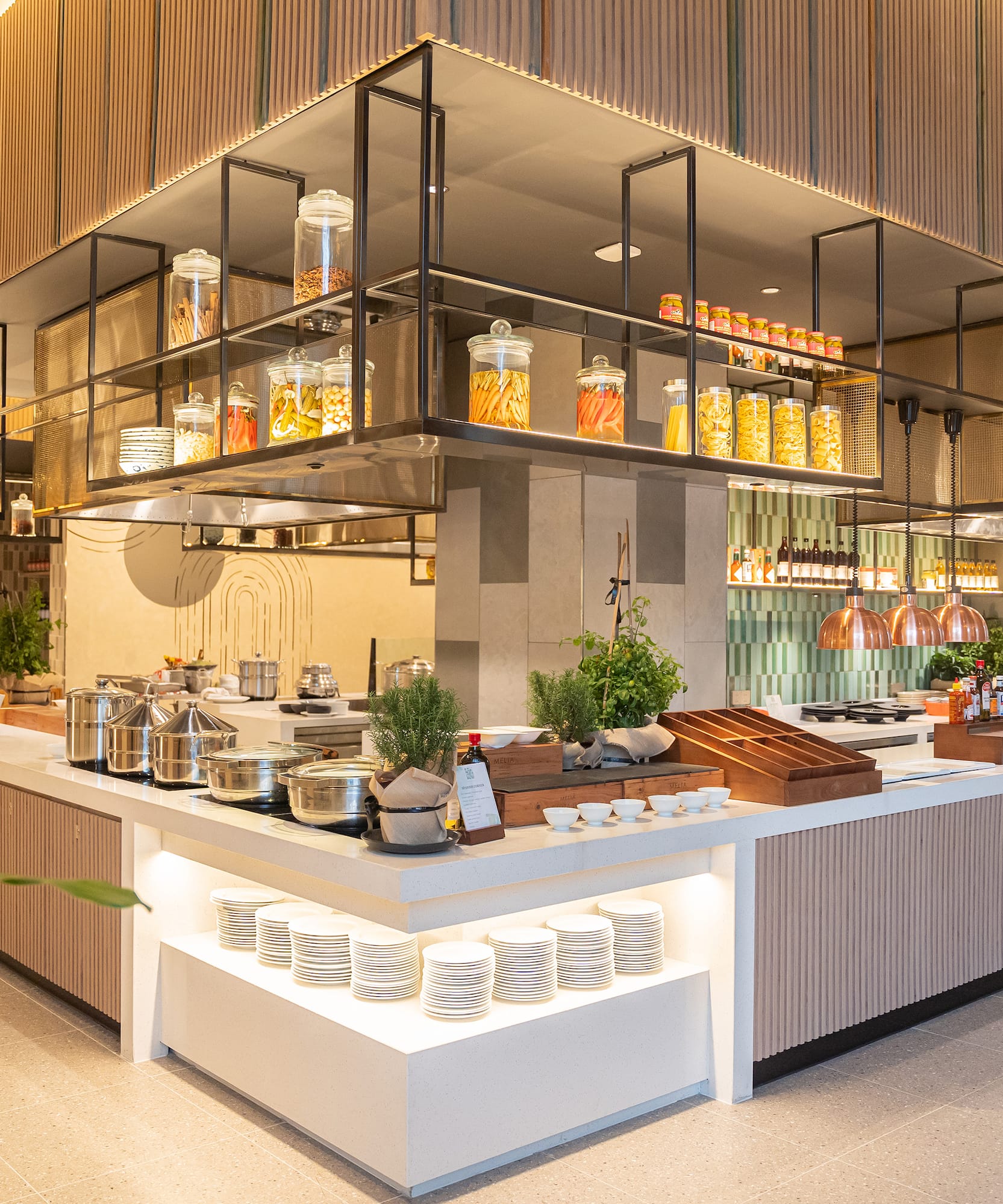 a kitchen with a large counter and shelves