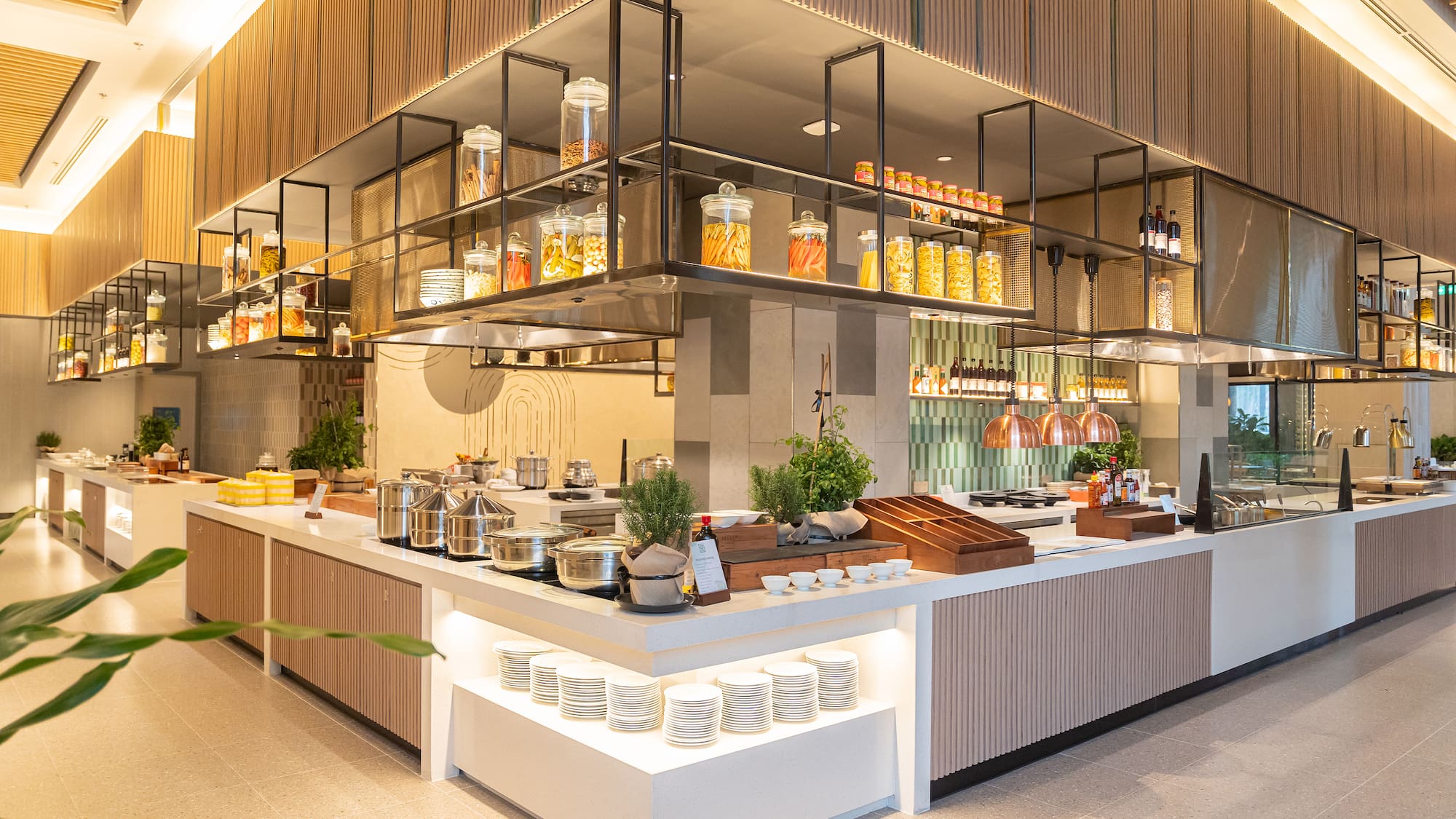 a kitchen with a large counter and shelves