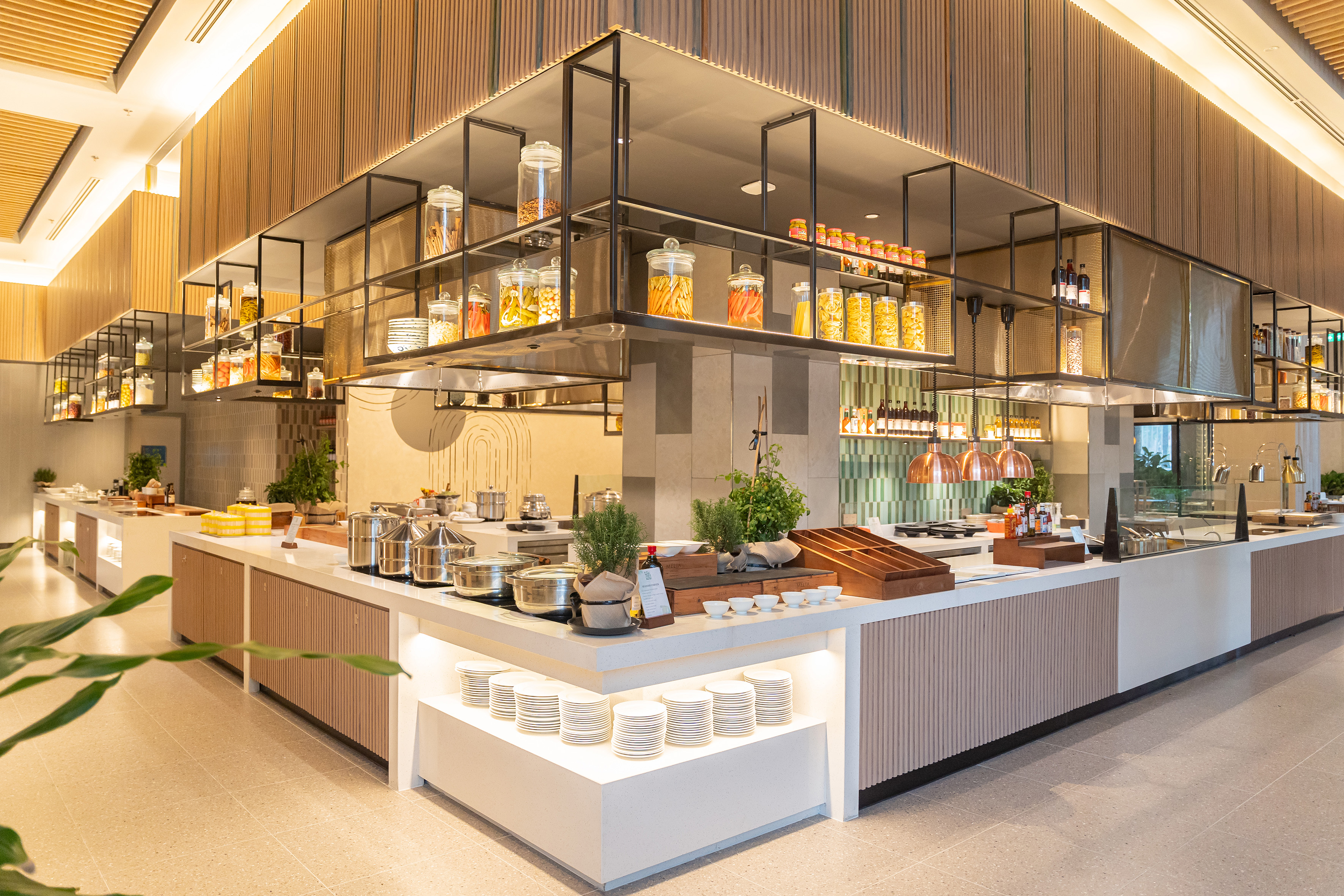 a kitchen with a large counter and shelves