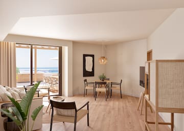 a room with a television and chairs