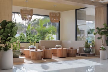 a room with a couch and tables