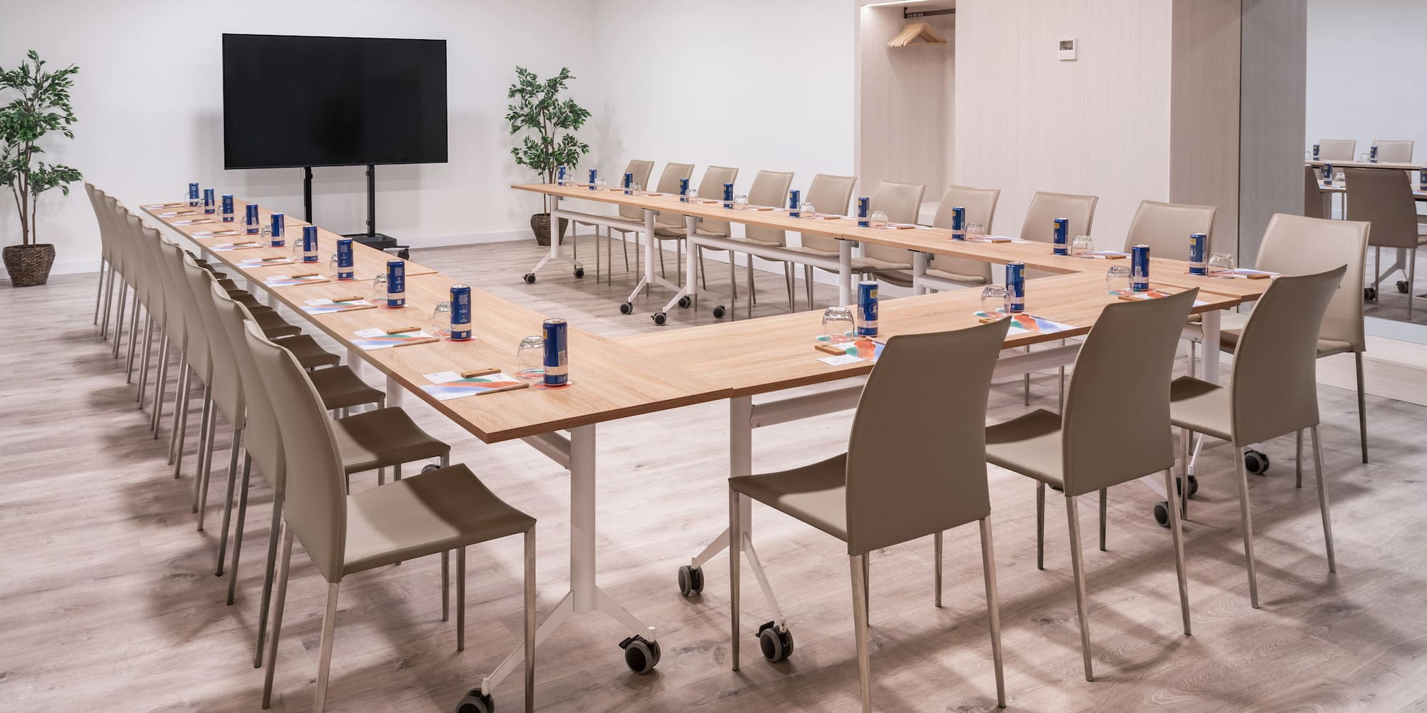 a room with a long table and chairs