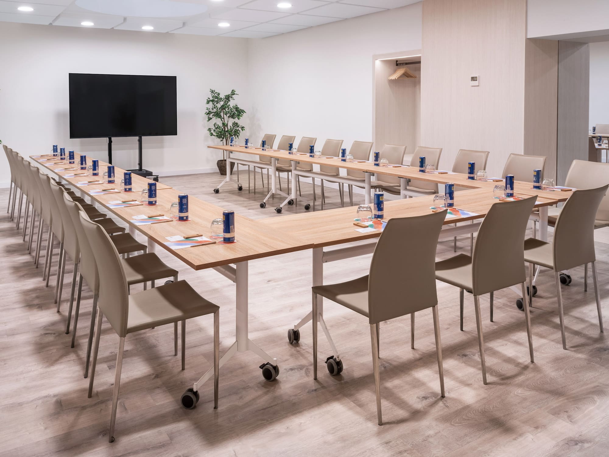 a room with a long table and chairs