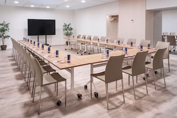 a room with a long table and chairs