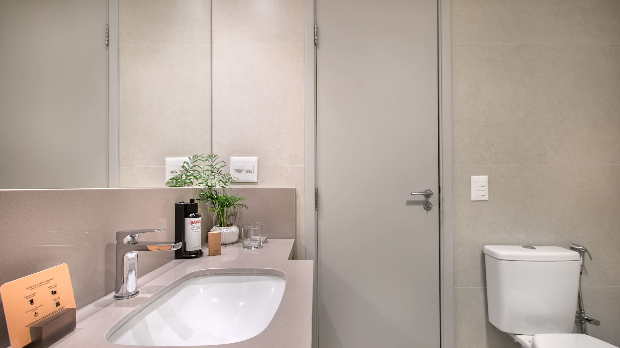 a bathroom with a sink and toilet