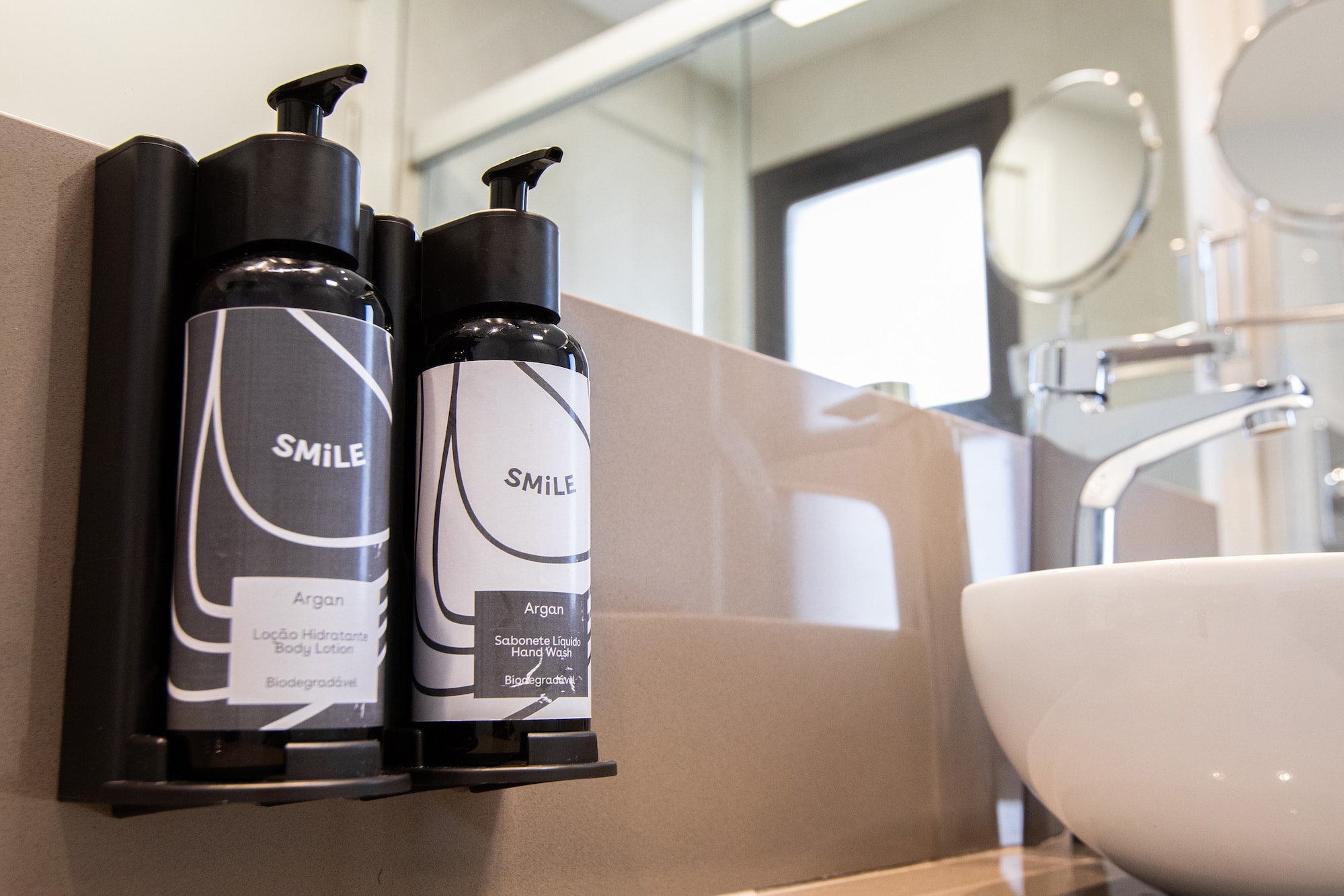 a group of black and white bottles on a counter