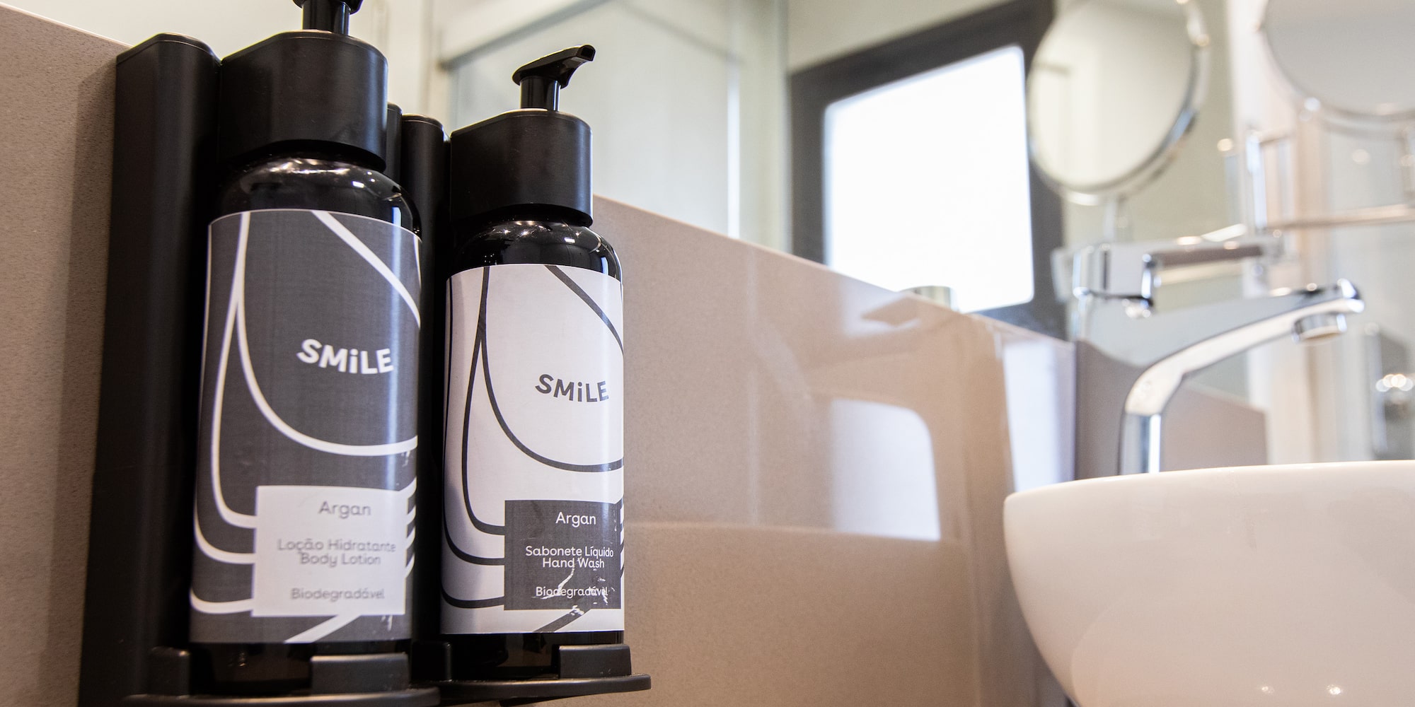 a group of black and white bottles on a counter