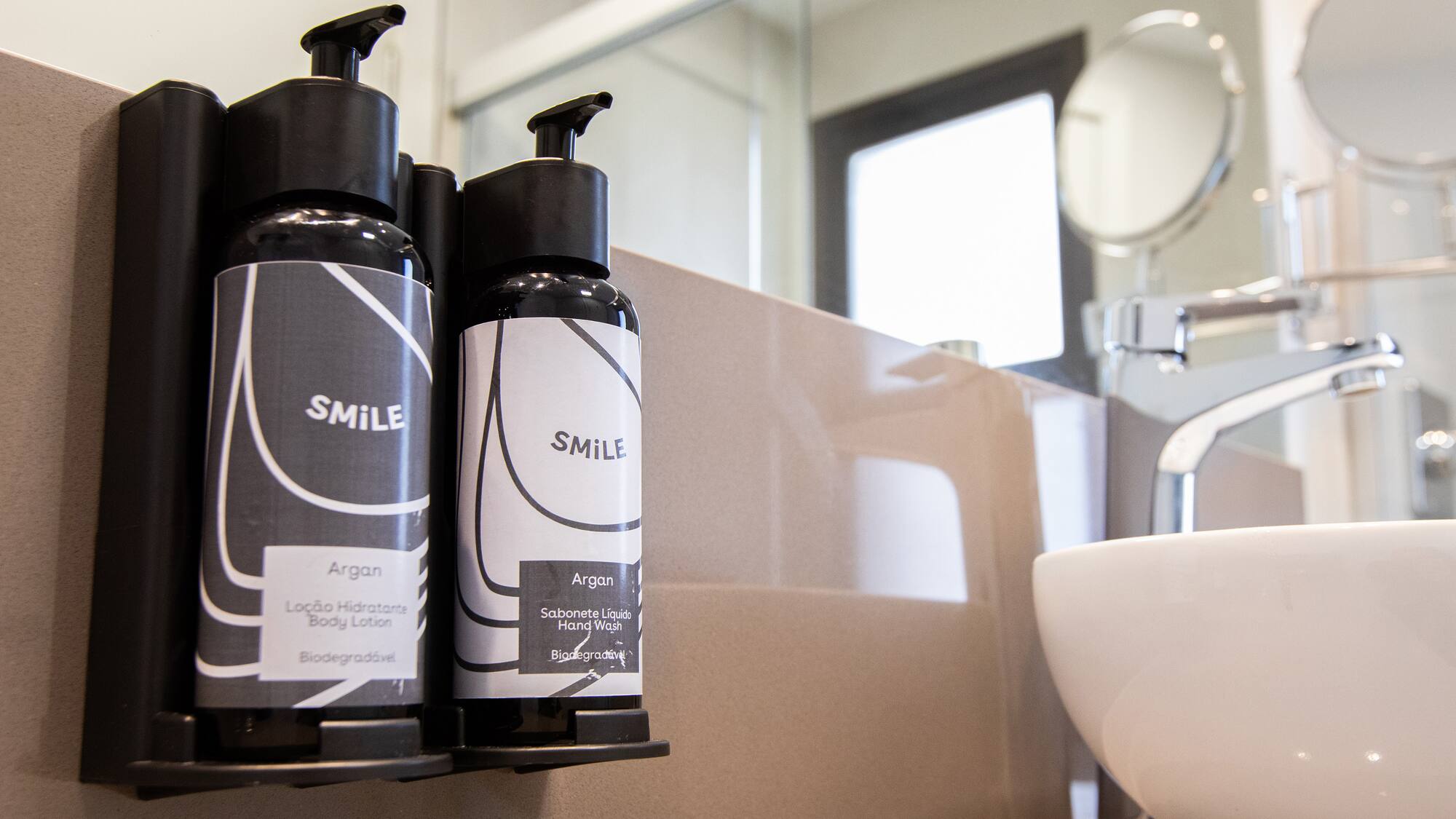 a group of black and white bottles on a counter