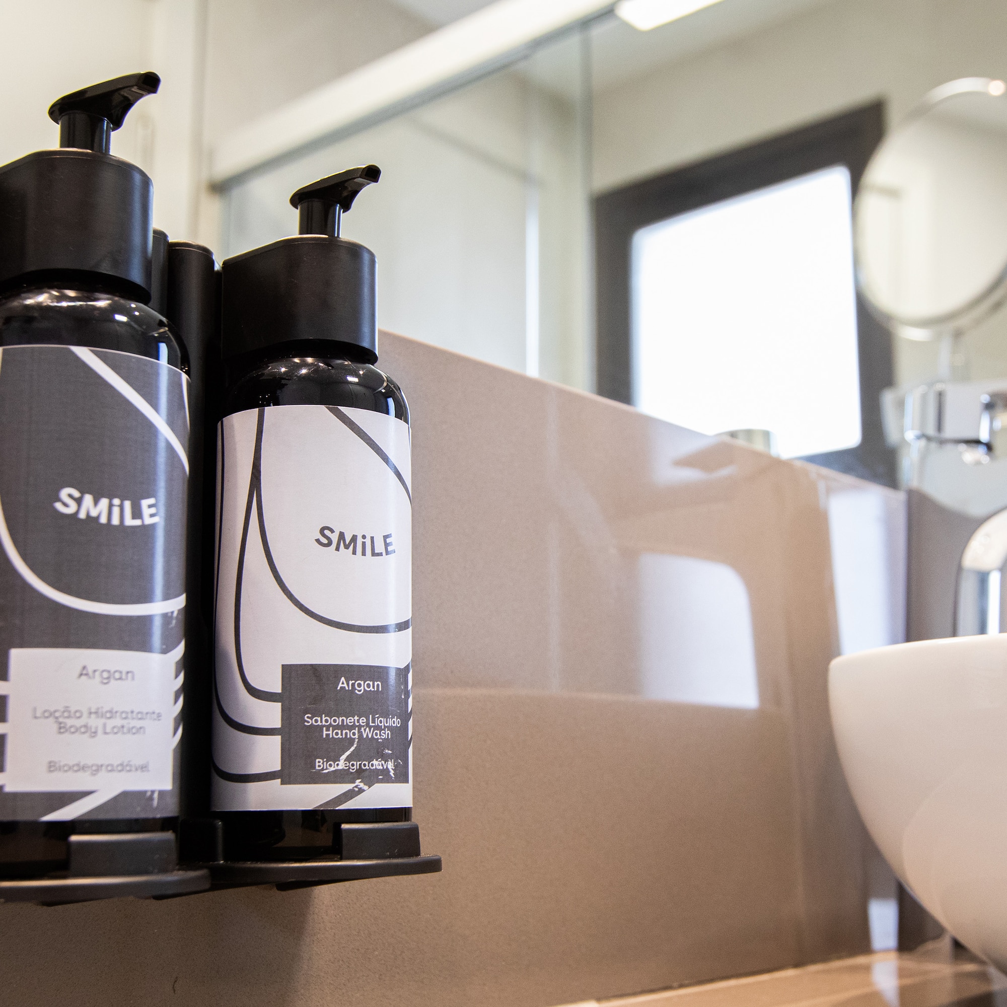 a group of black and white bottles on a counter