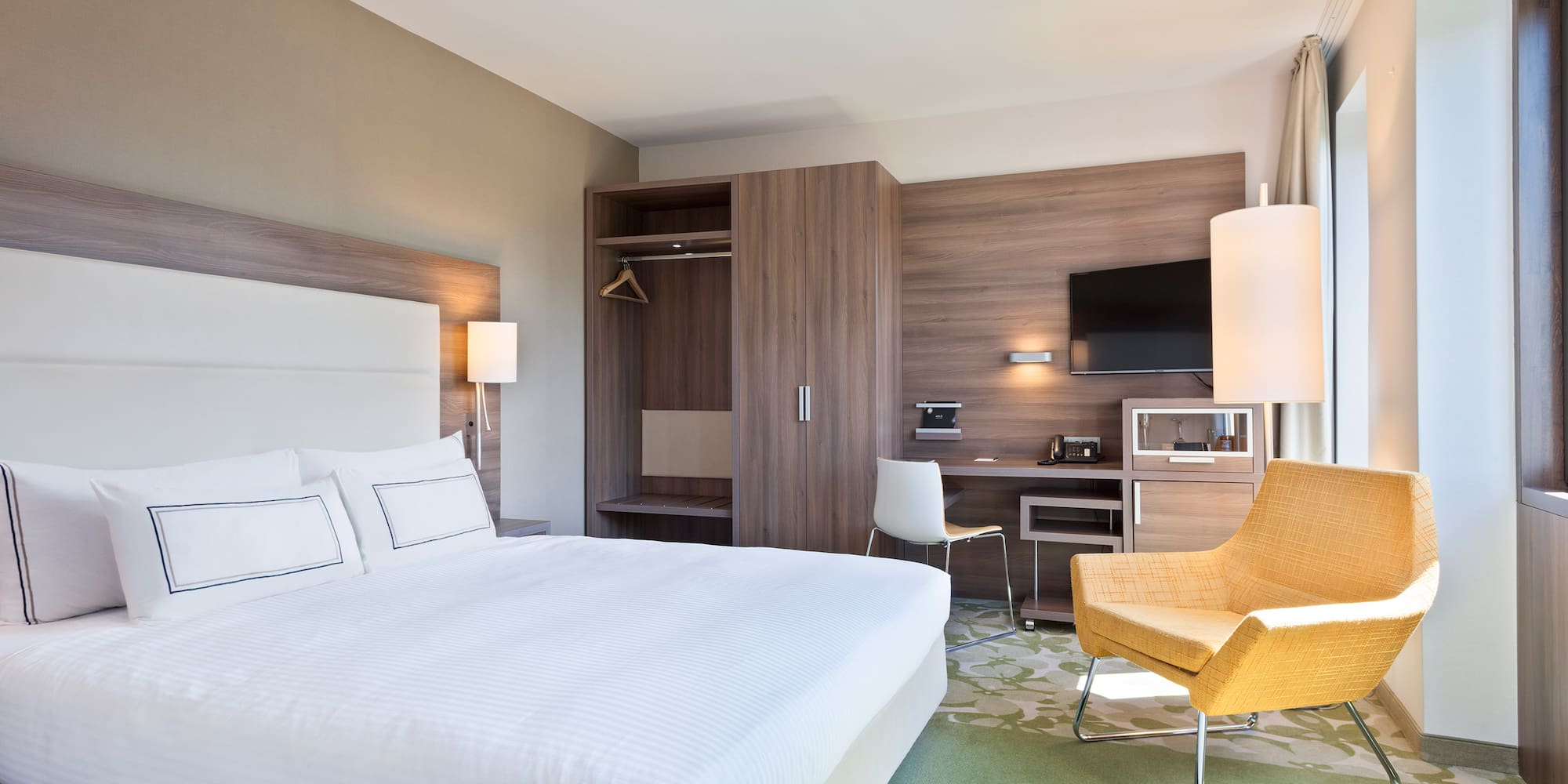 a room with a bed and a chair