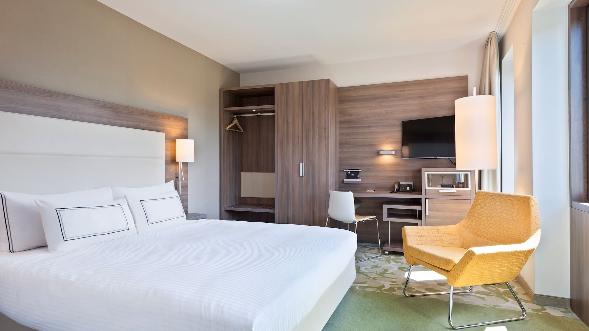 a room with a bed and a chair