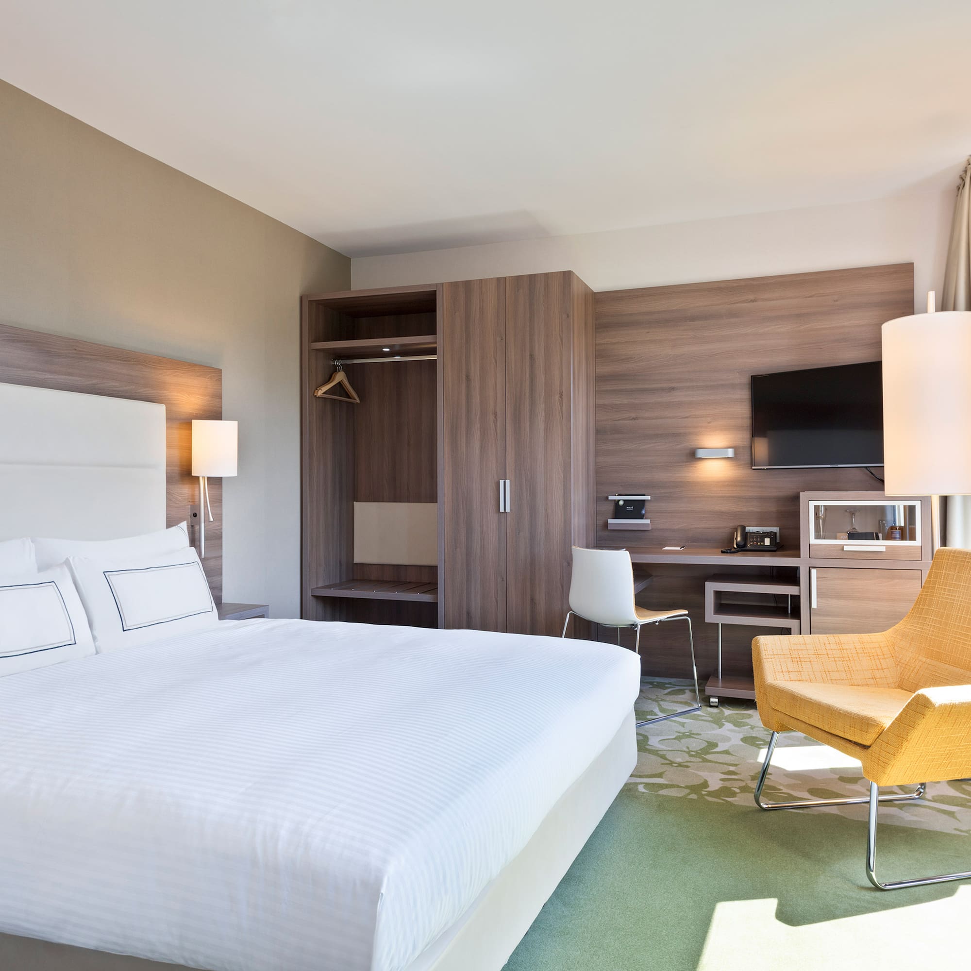 a room with a bed and a chair