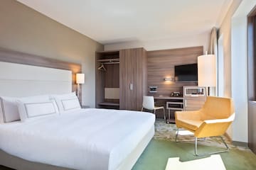 a room with a bed and a chair