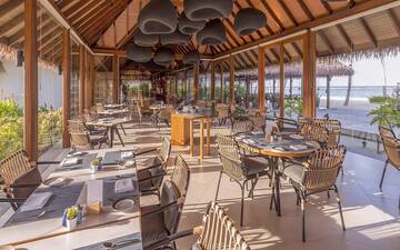 a restaurant with tables and chairs