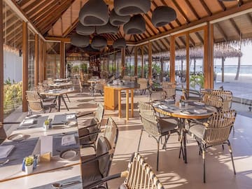 a restaurant with tables and chairs