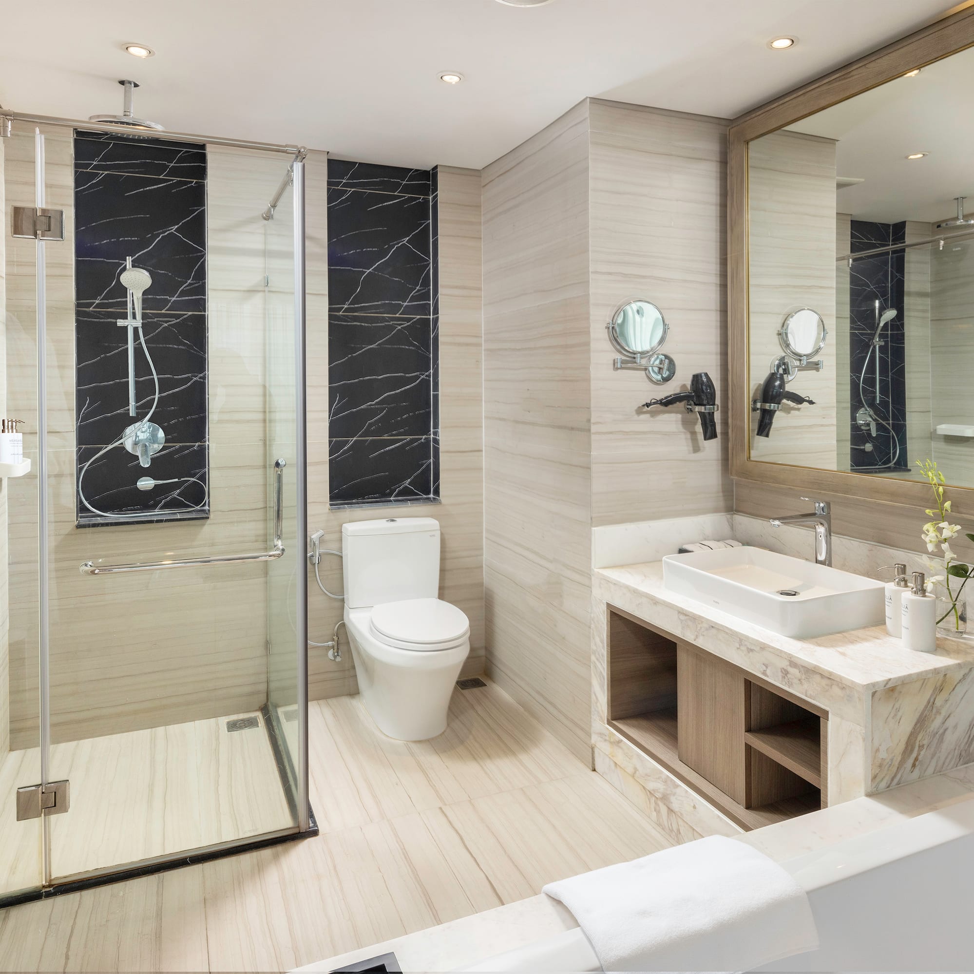 a bathroom with a shower and toilet